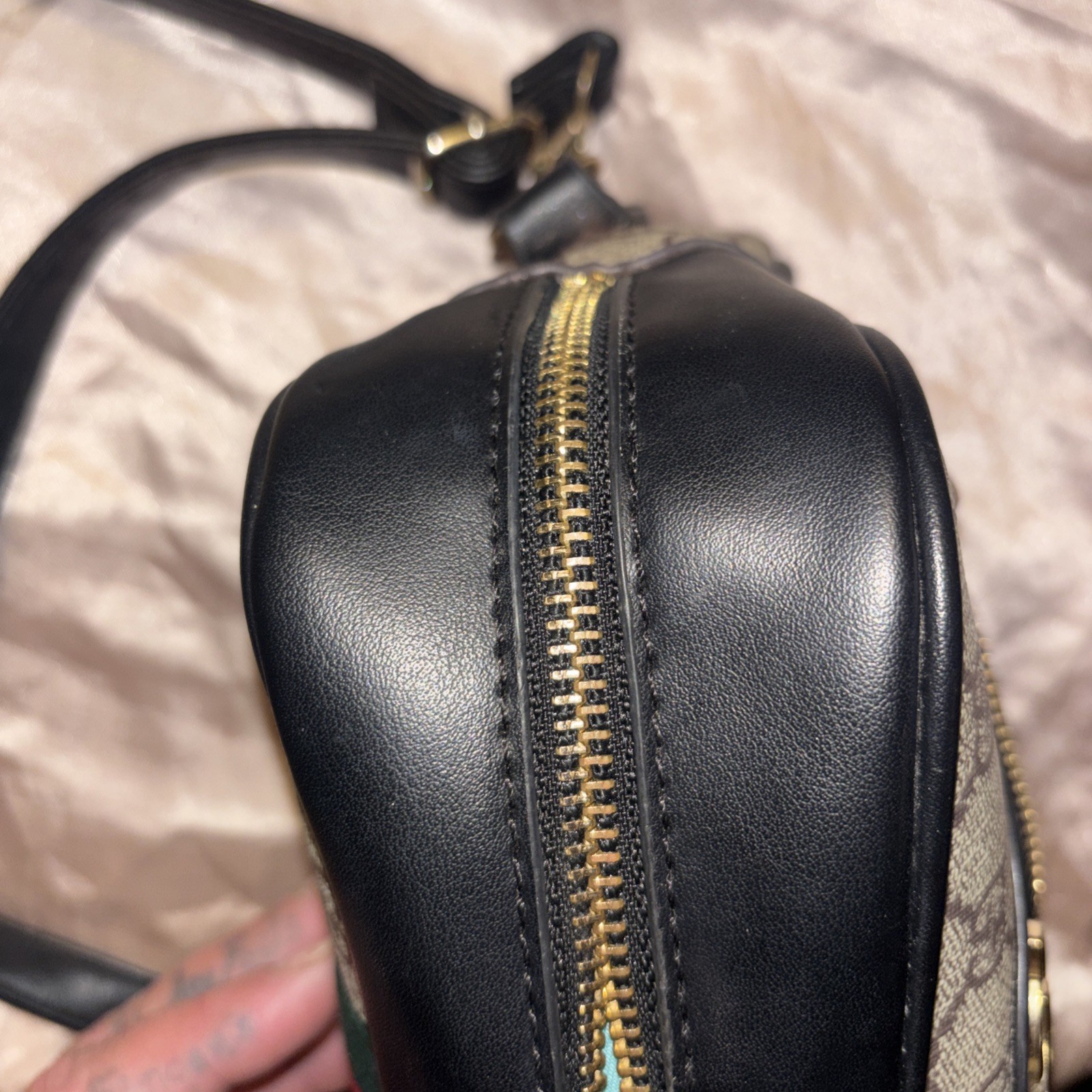 This is a Gucci GG Supreme Ophidia camera-style shoulder bag.