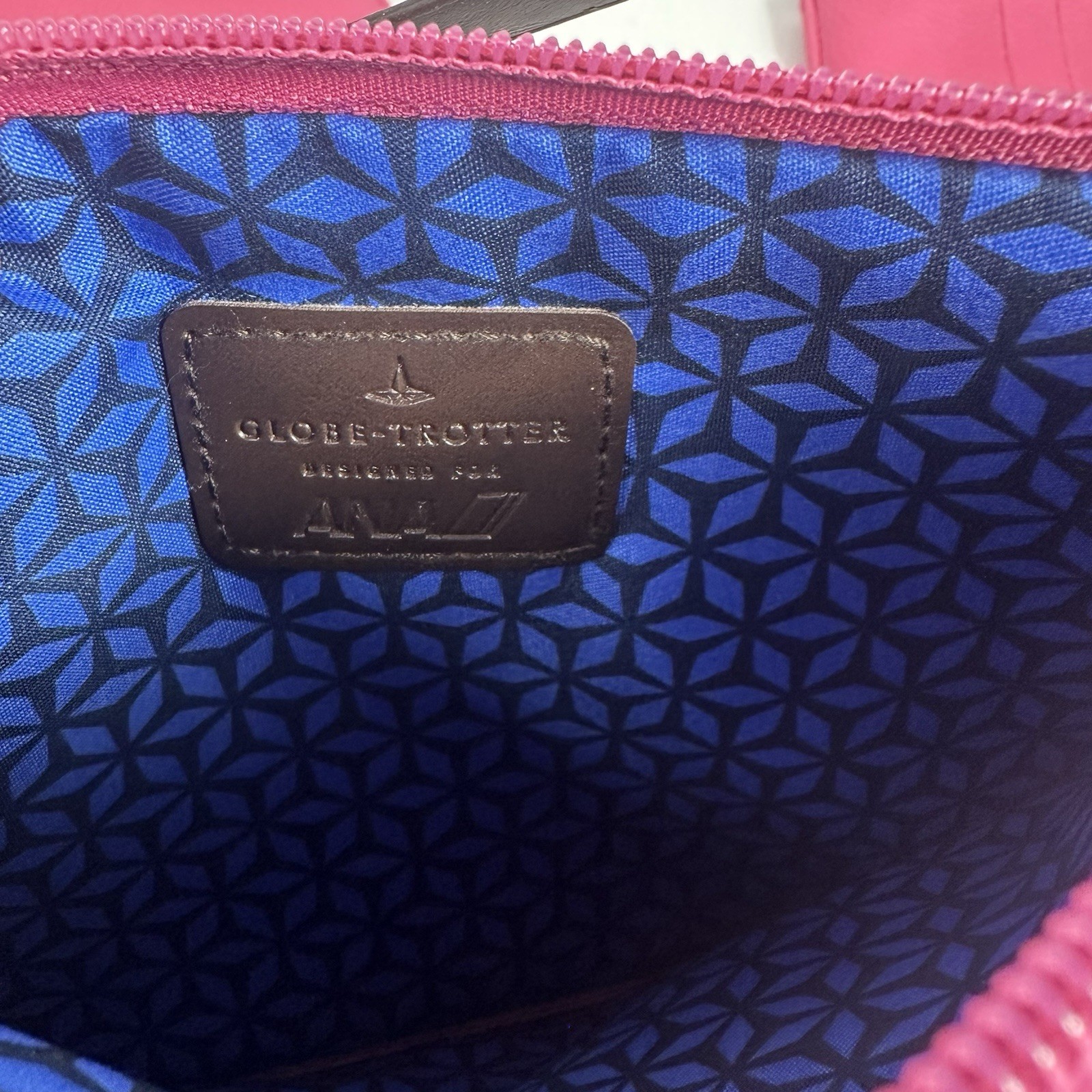Globe-Trotter x ANA Pink Zip Wristlet Clutch, Black Strap, Geometric Lined