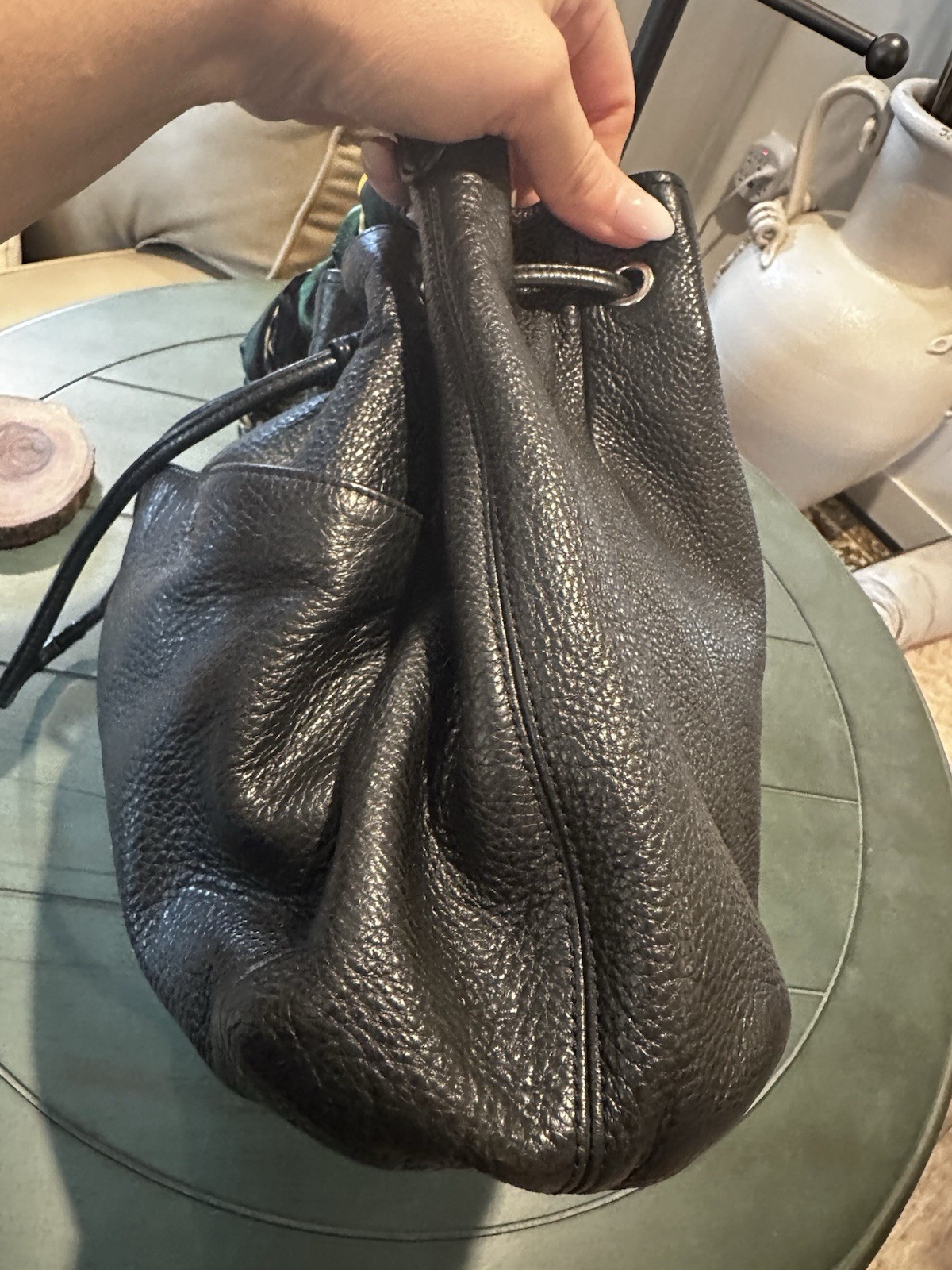 Coach Avery bucket bag. Drawstring closure and silver-tone hardware.