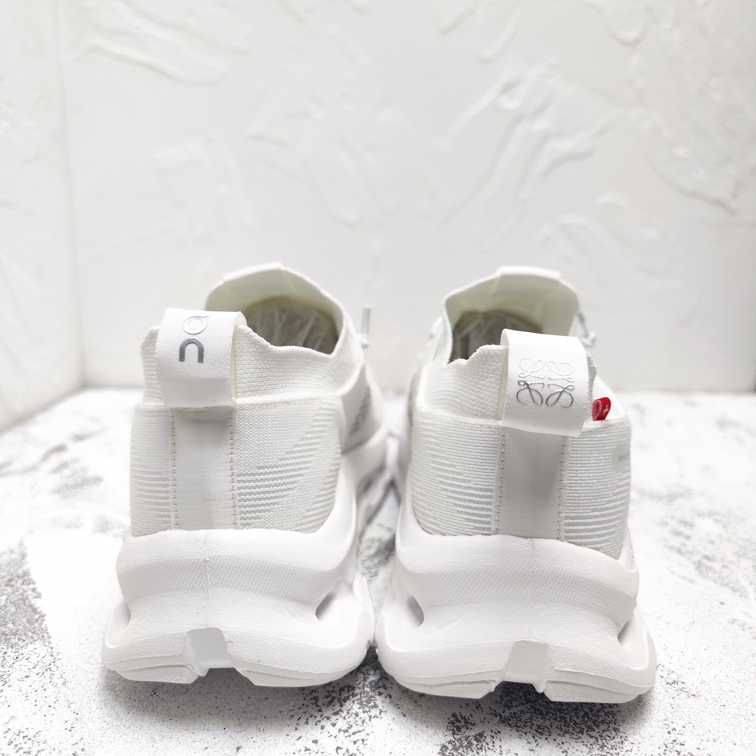 Rowei Cloud Layer Inclined White Elastic Hollowed Sole Men’s Sports Shoes