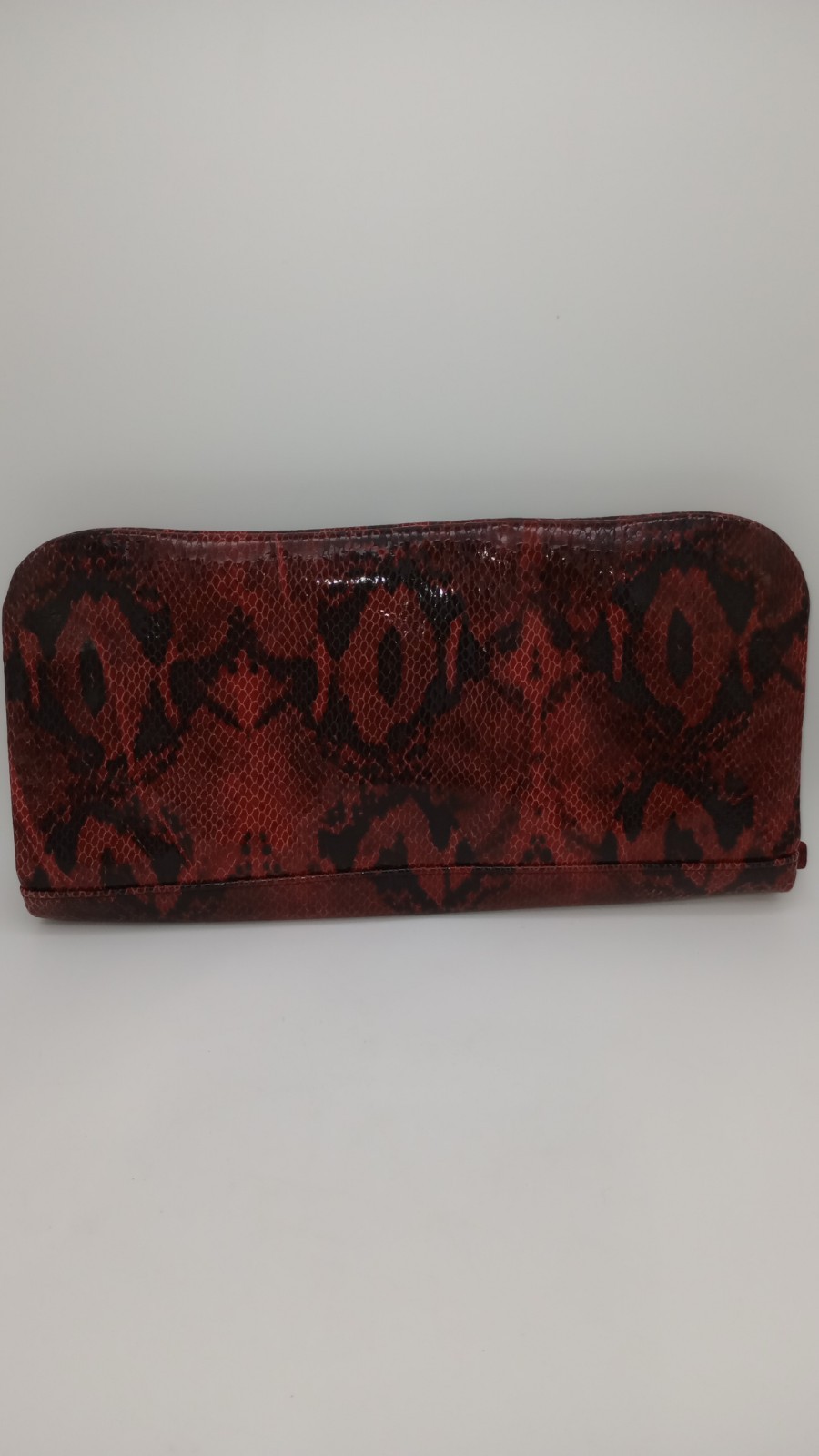 Elevate your style with this stunning Kate Landry Red Leather Clutch Purse.