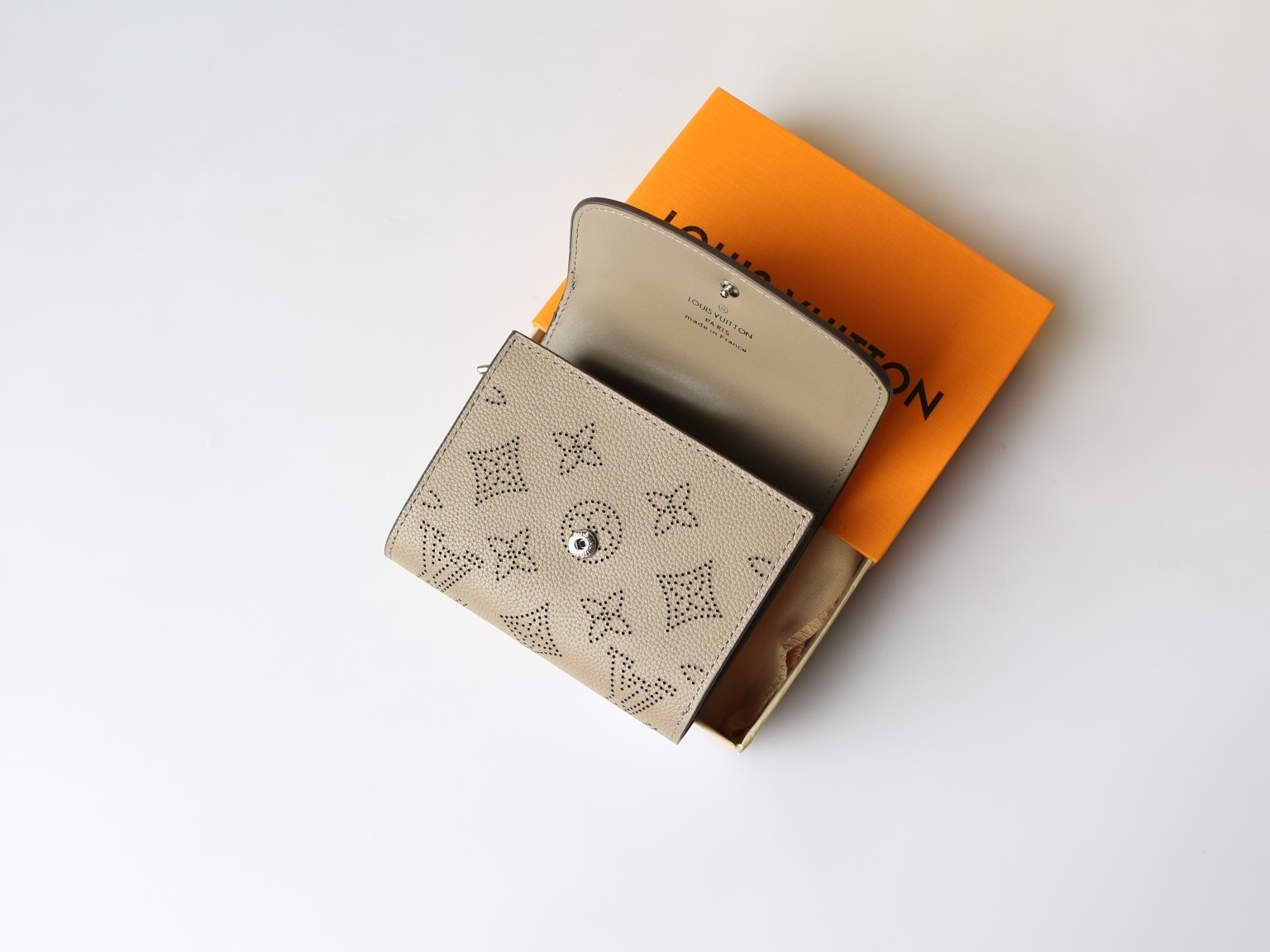 LOUIS Beige Mahina Perforated Leather Iris Compact Wallet