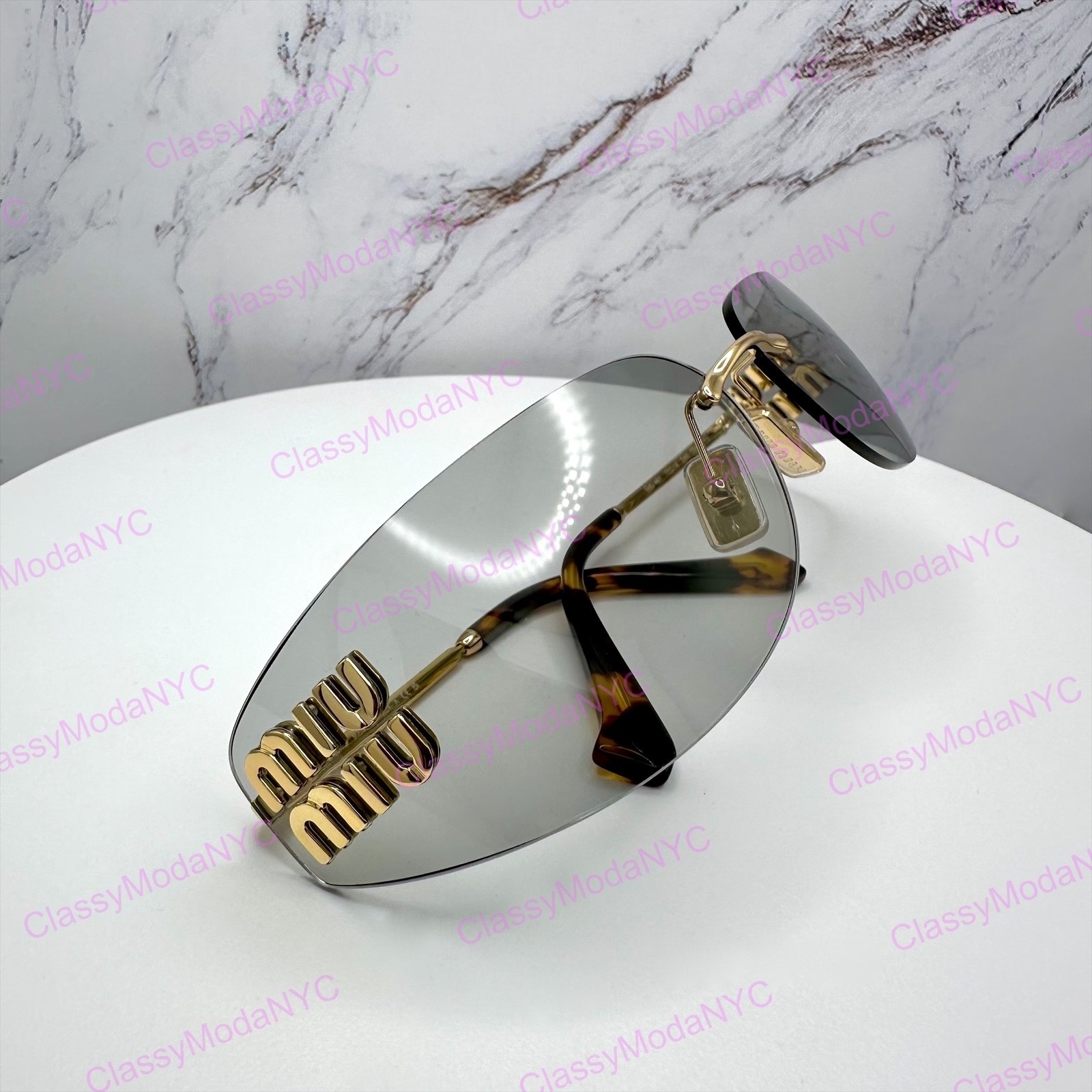 New MIU MIU Sunglasses Gold Slim Runway Wrap Rimless MU A51S 5AK50K Authentic