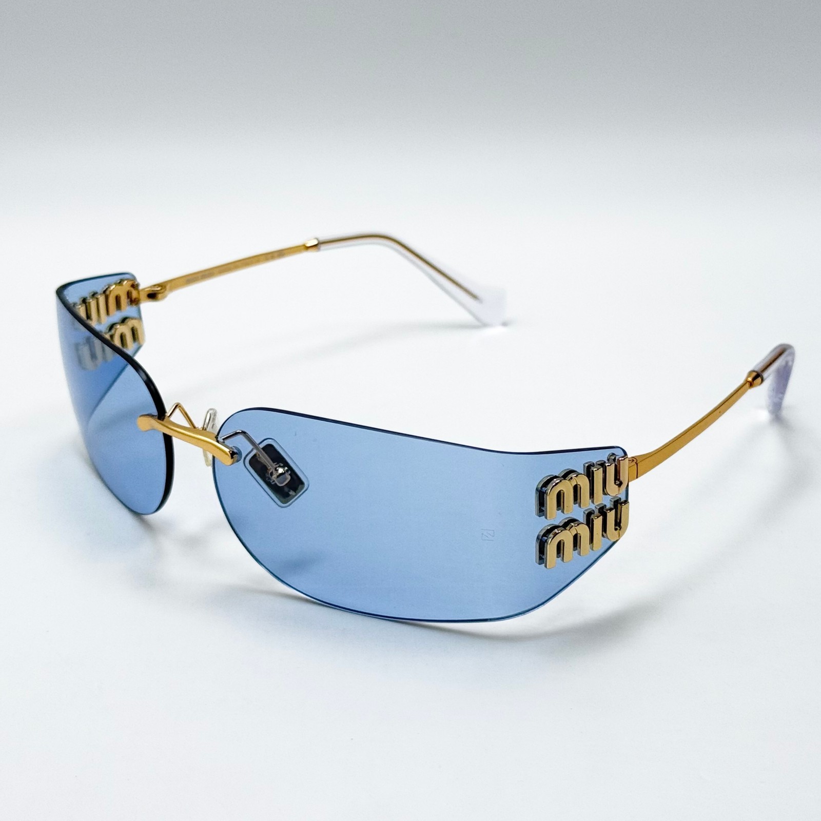 Miu Miu SMUA51 Wrap Sunglasses Pale Gold Frame Blue Lens Women 75-14-110