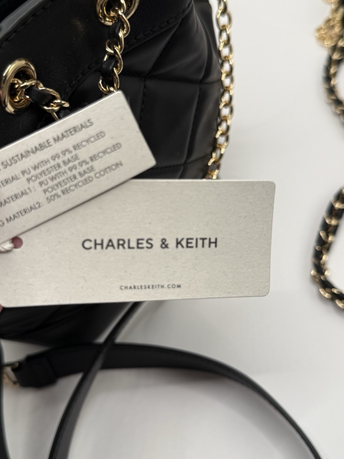 CHARLES & KEITH Black Quilted Small Bucket Drawstring Crossbody Gold Chain