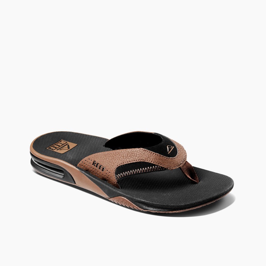 REEF Men’s Fanning Bottle Opener Flip Flop Regular Sandal – Black/Tan, Sizes