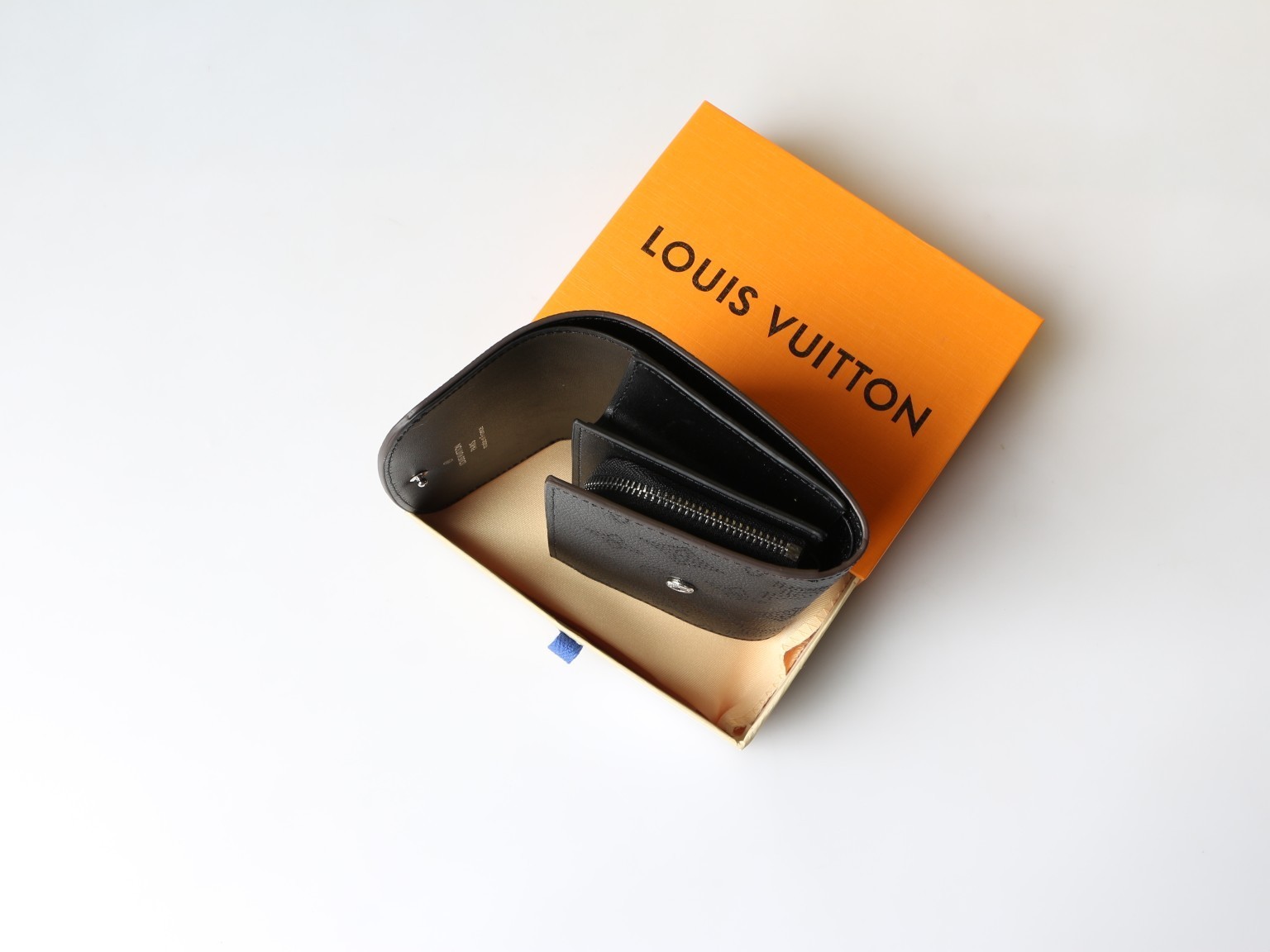 LOUIS Black Mahina Perforated Leather Iris Compact Wallet