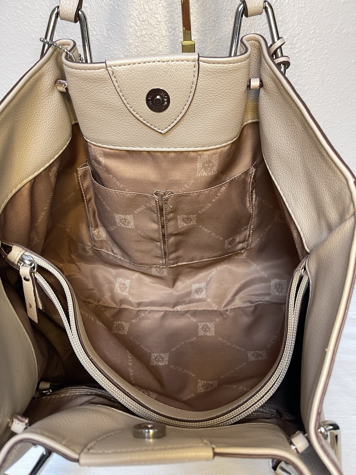 Anne Klein Taupe Vegan Pebbled Texture Tote with Lion and Tassel Charms