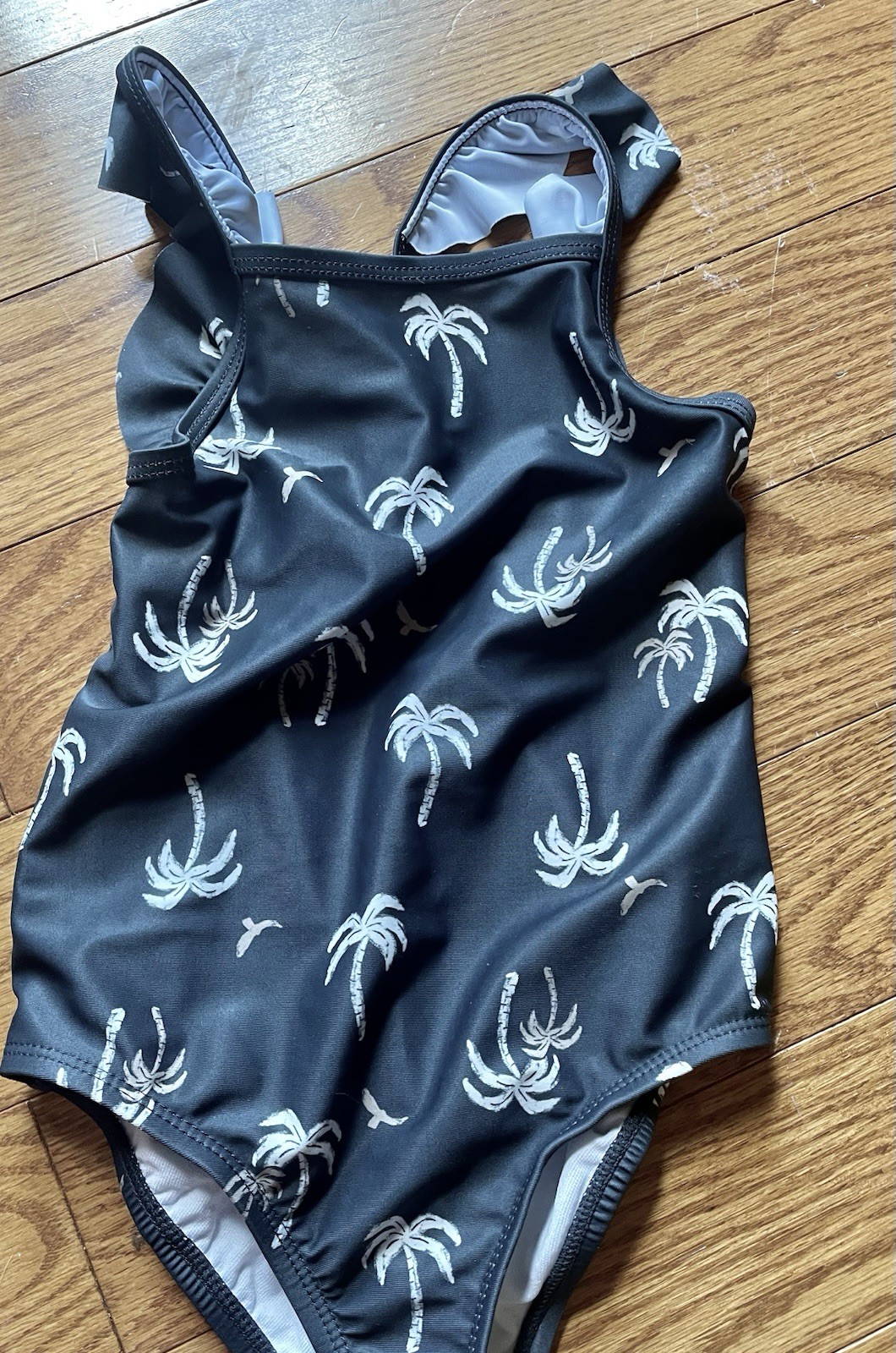 Carters Girl 5T. 1 Piece Swimsuit, Worn 1x excellent, Palm Trees Grey Background