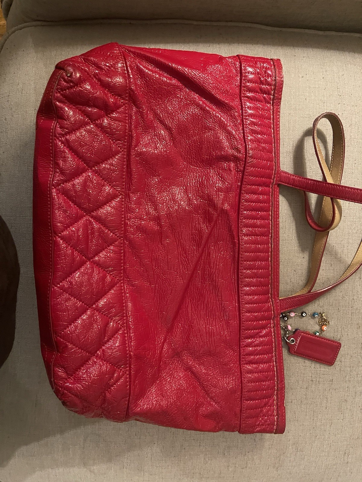 Coach Poppy Daisy Liquid Gloss tote bag, featuring quilted red patent leather