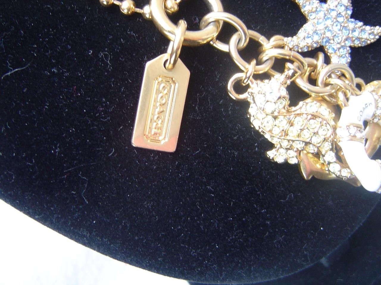 AUTHENTIC COACH GOLD TONE PIERRE LE TAN NAUTICAL CHARMS 28″ NECKLACE EUC