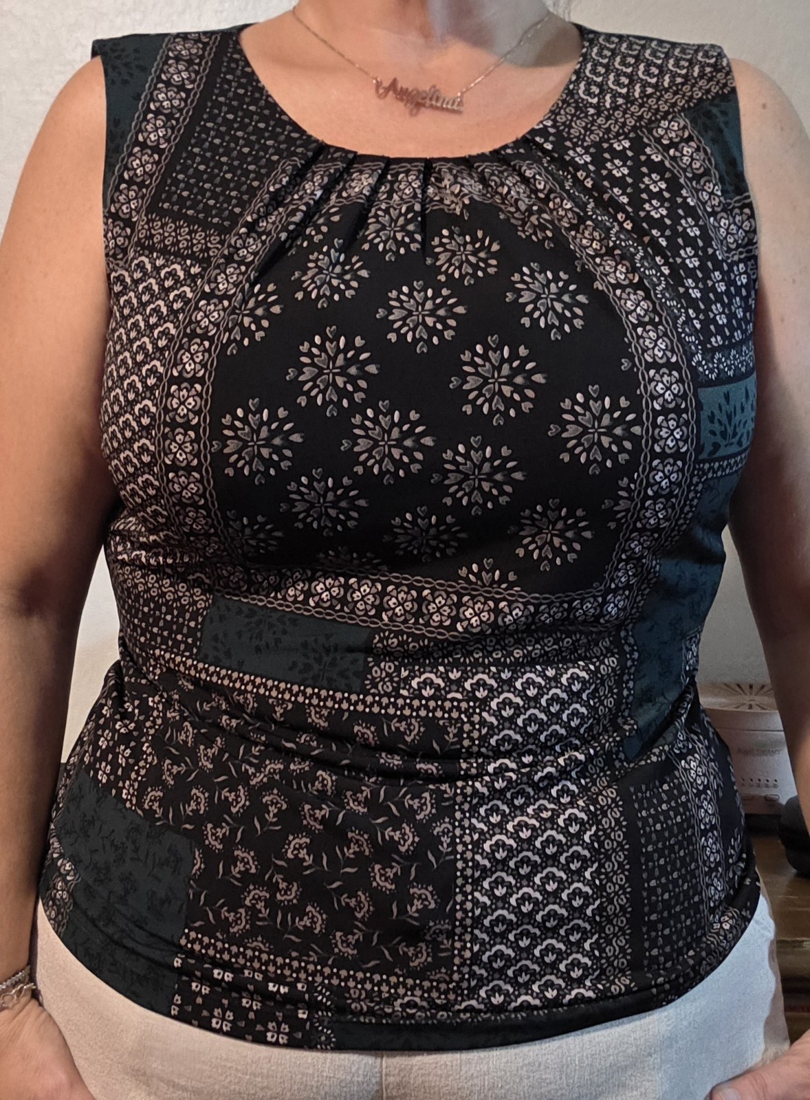 Calvin Klein sleeveless, featuring a black and navy patchwork bandana print. L