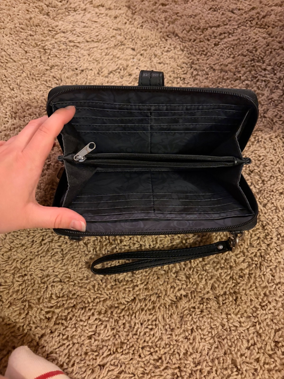 Sakroots black clutch used