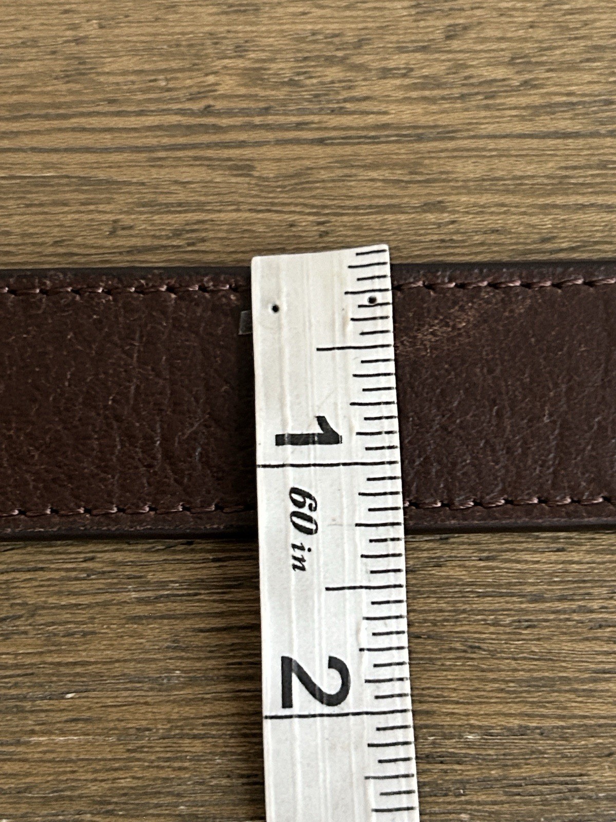 Anson Men’s Brown Leather Adjustable Belt. Metal Buckle. Logo Accent.