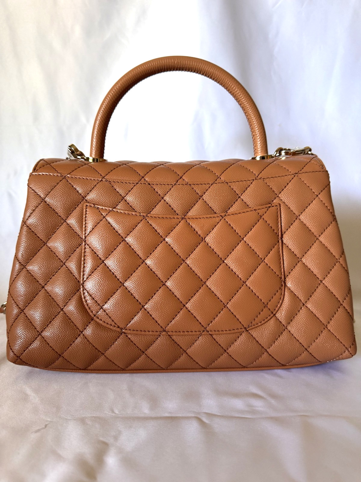 Chanel small flap bag with top handle caramel/cognac brown caviar leather