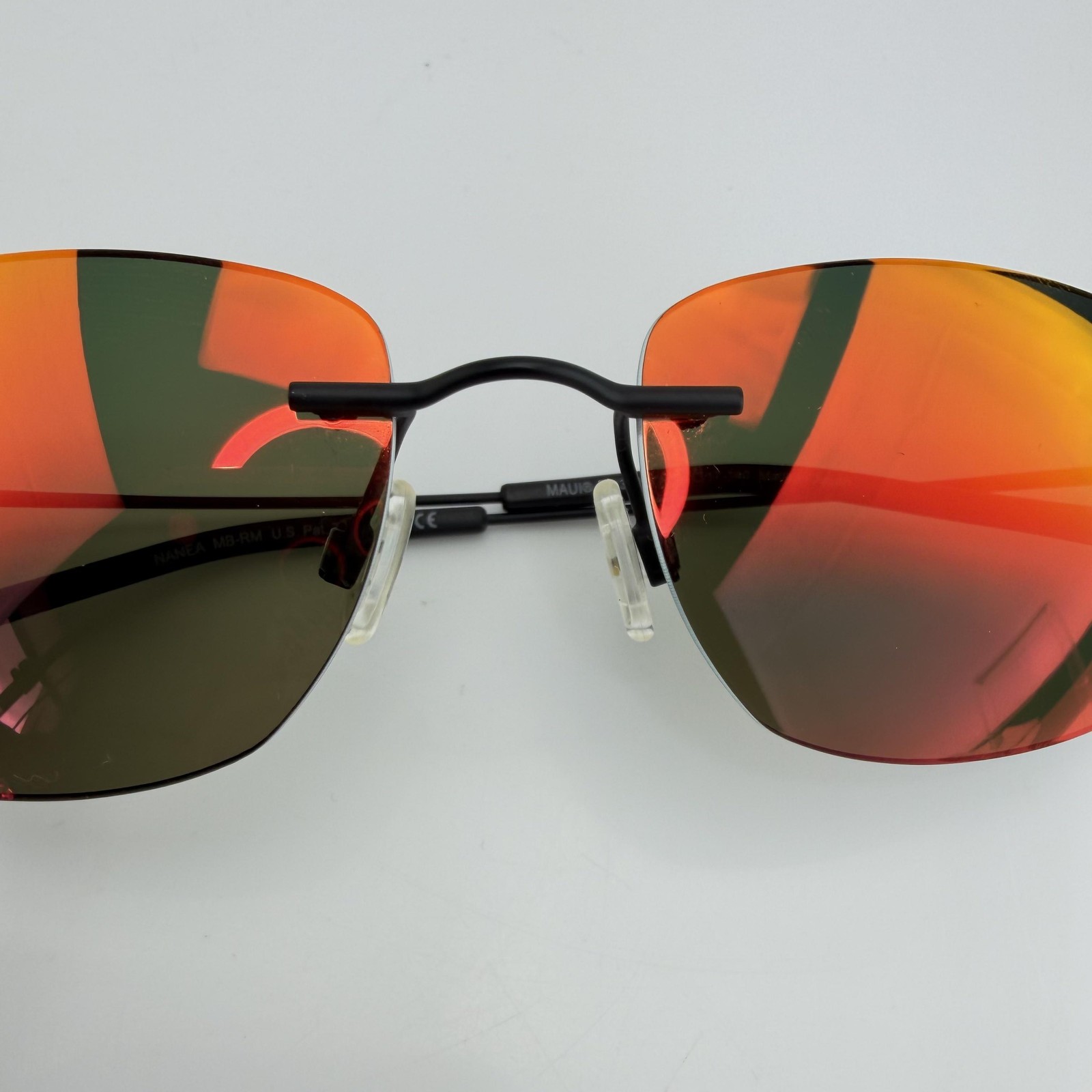 Maui Jim Sunglasses Nanea MJ332-2M Mens Black Rimless Orange Mirrored Polarized