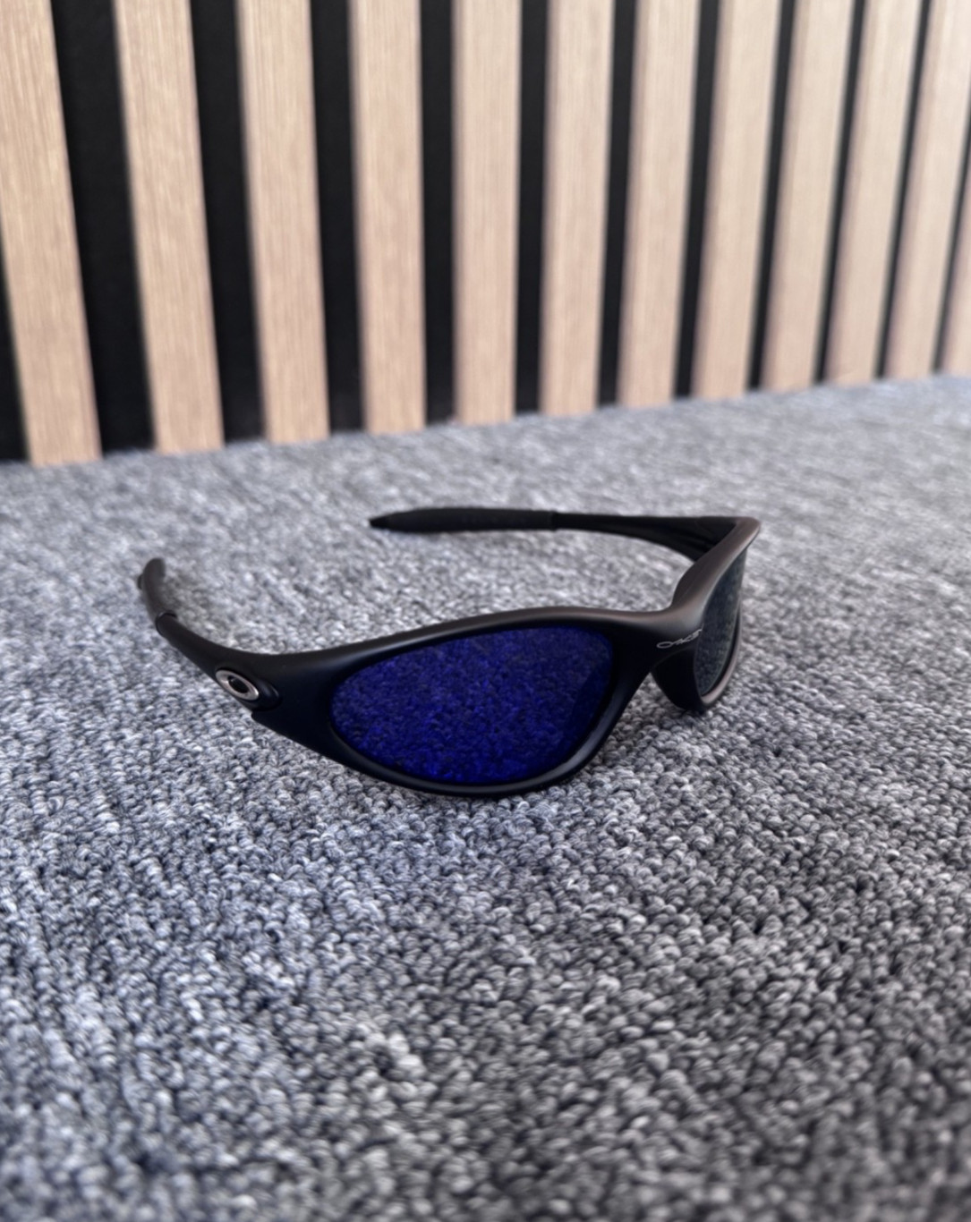 Oakley Minute sunglasses unisex black frame with blue see trough lenses