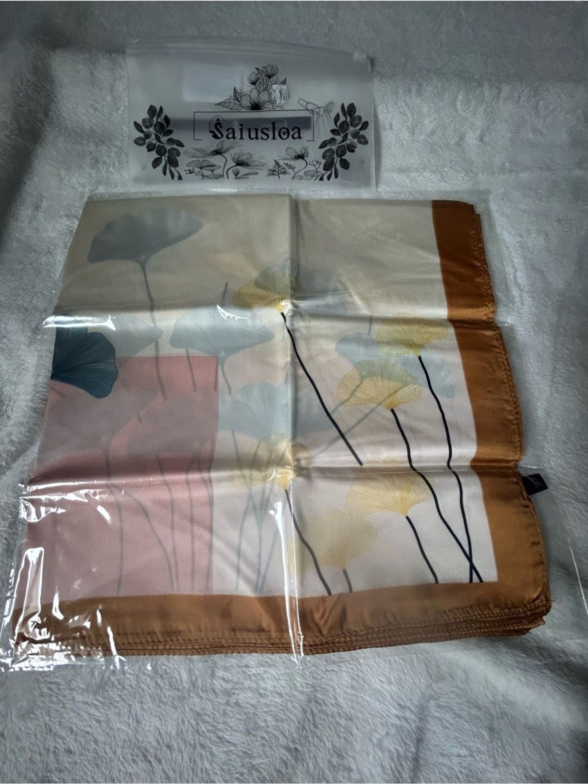 Saiusloa ginkgo leaf scarf designed to provide a “silk-like” feel—smooth,