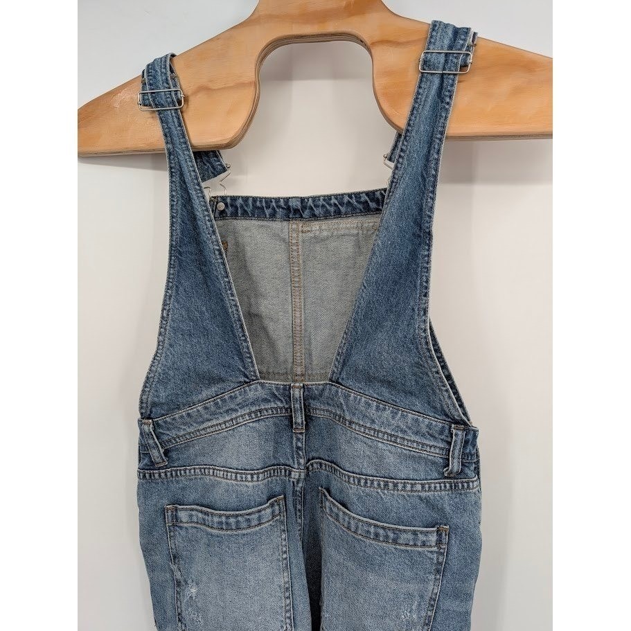 Free People We the Free Denim Overalls light blue distressed Women’s sz 27