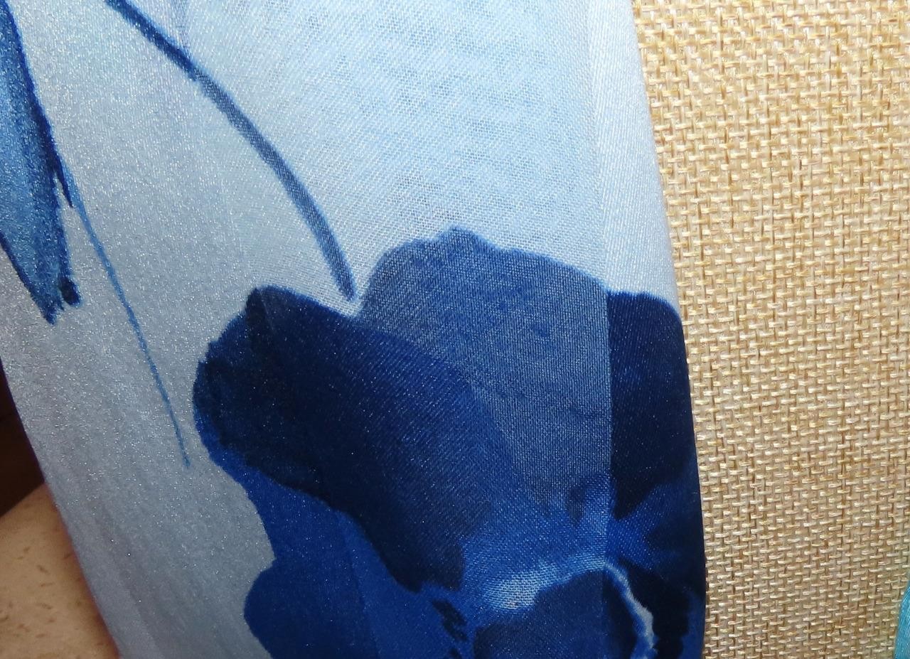 Oblong floral scarf; blue tones, white; 60×14.5 in. Semisheer; poly blend?