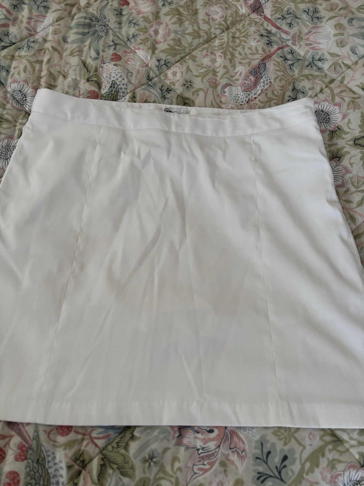 Womens Skorts (4). White, turquoise, tan and yellow. Size 12.