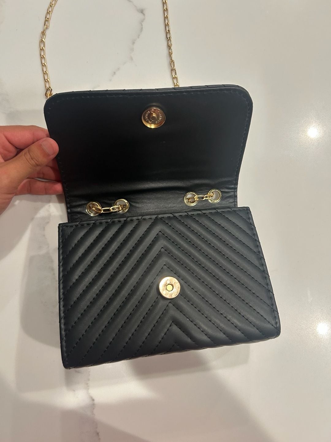 V-Logo Quilted Black Crossbody Bag with Gold Chain and Tassel