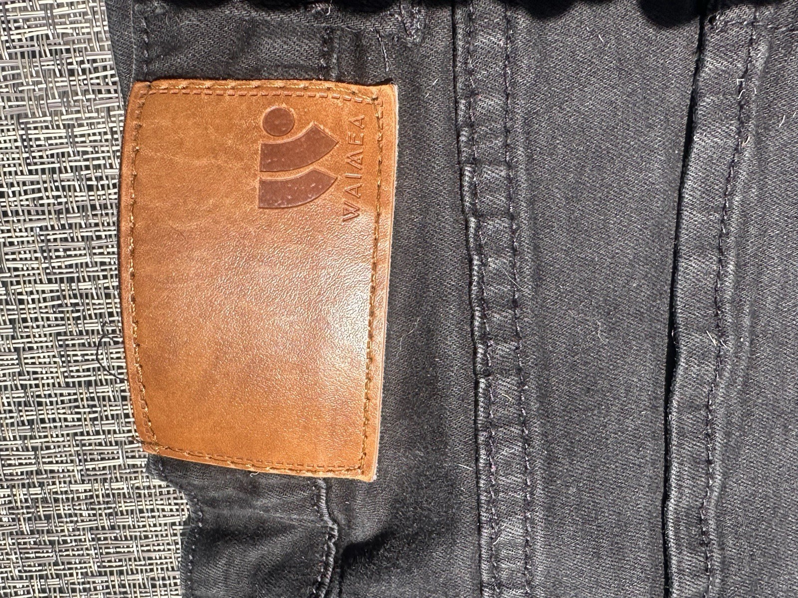 Waimea black skinny jeans with rhinestone skull. Size 32