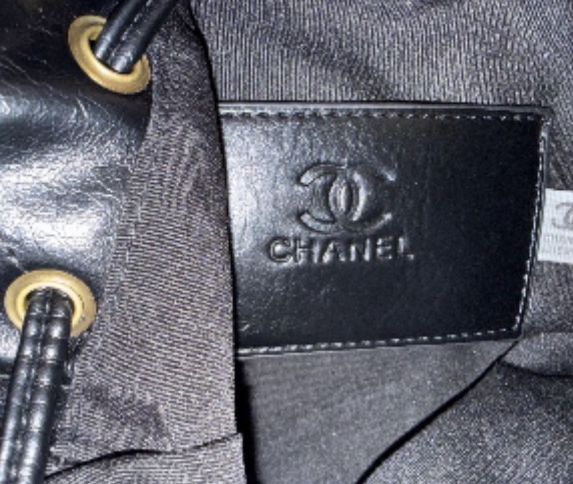 CHANEL Mini Black Quilted Drawstring Bucket Bag with Gold Chain Strap Charm