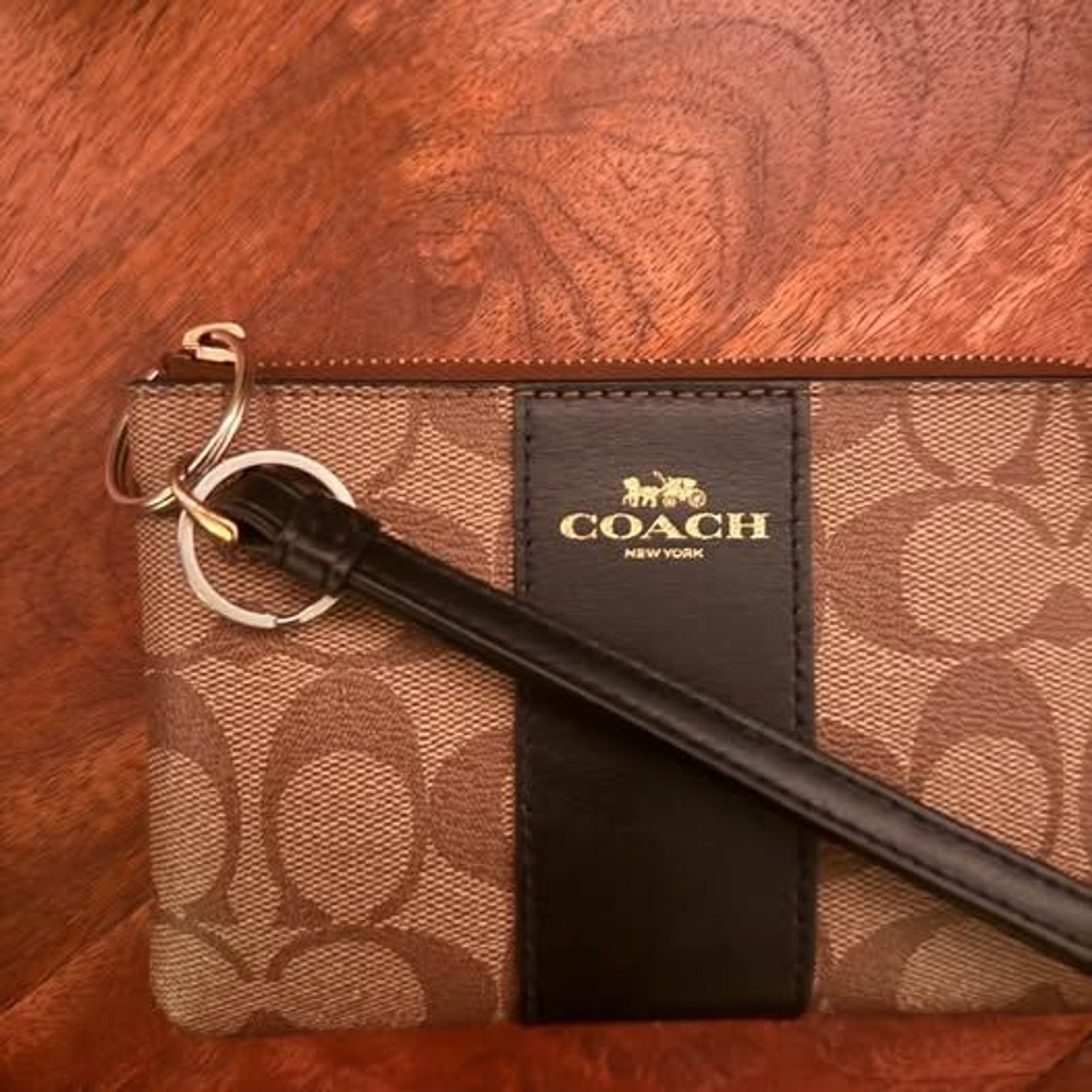 Coach wristlet with black accents