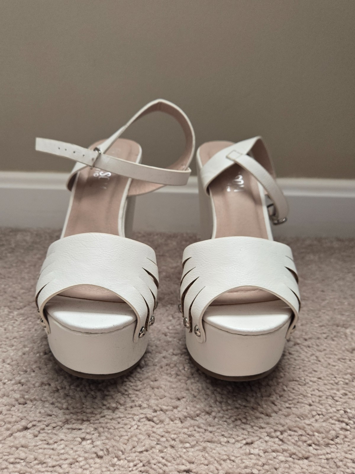 Brand new. Never worn. White faux soft leather high heels with wide heel