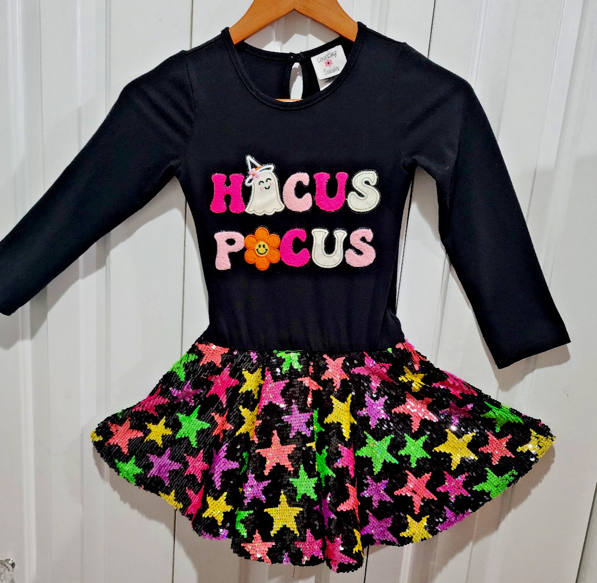 Counting Daisies girls 7 – 8 Black Hocus Pocus dress. Colorful sequins