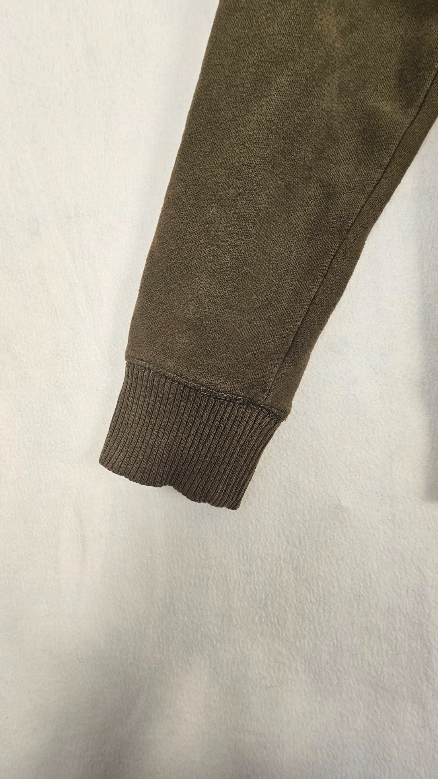 olive green full-zip hoodie features a cozy fleece lining, an adjustable drawstr