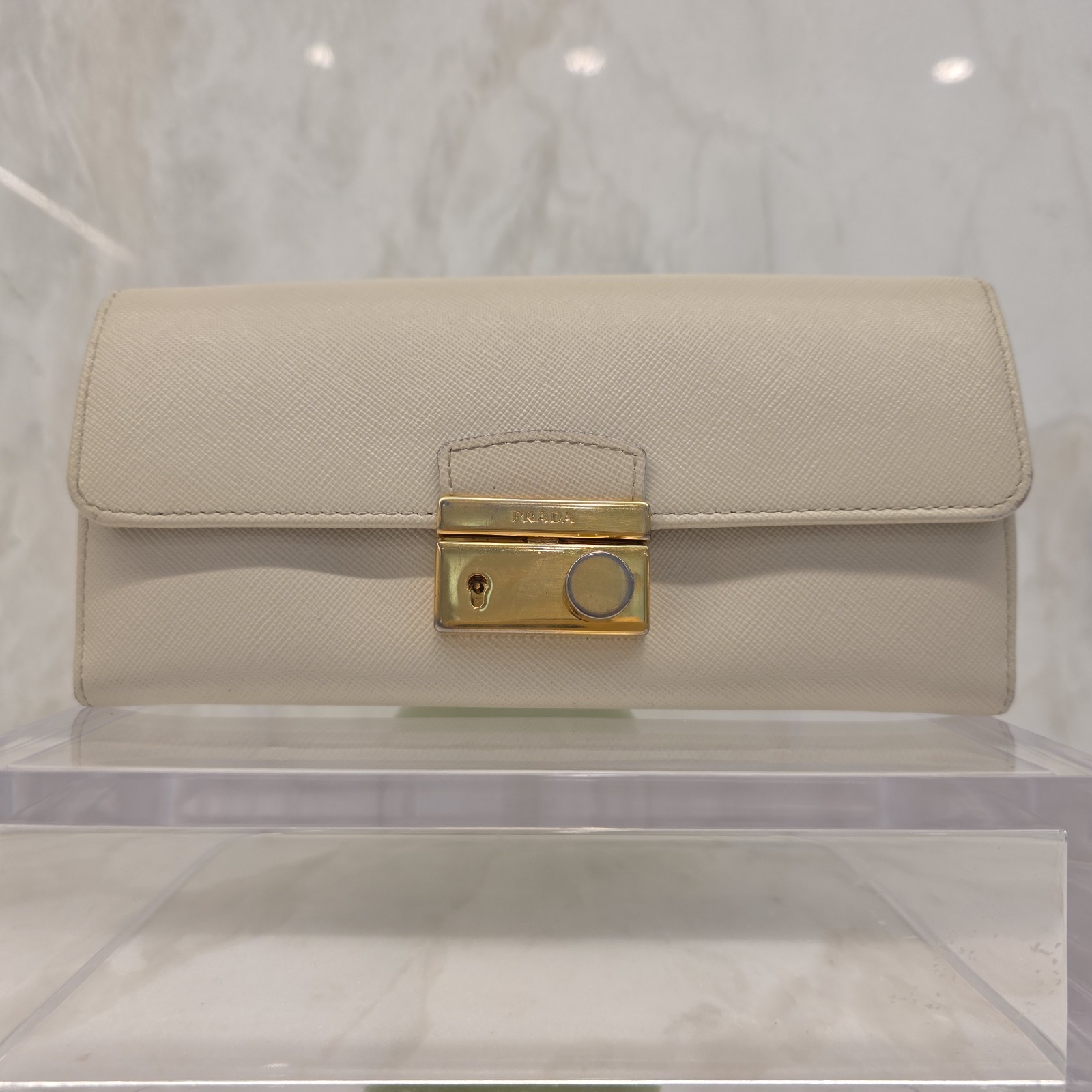 Prada Saffiano Push Lock Wallet In Creamy Beige Color with Goldtone Hardware
