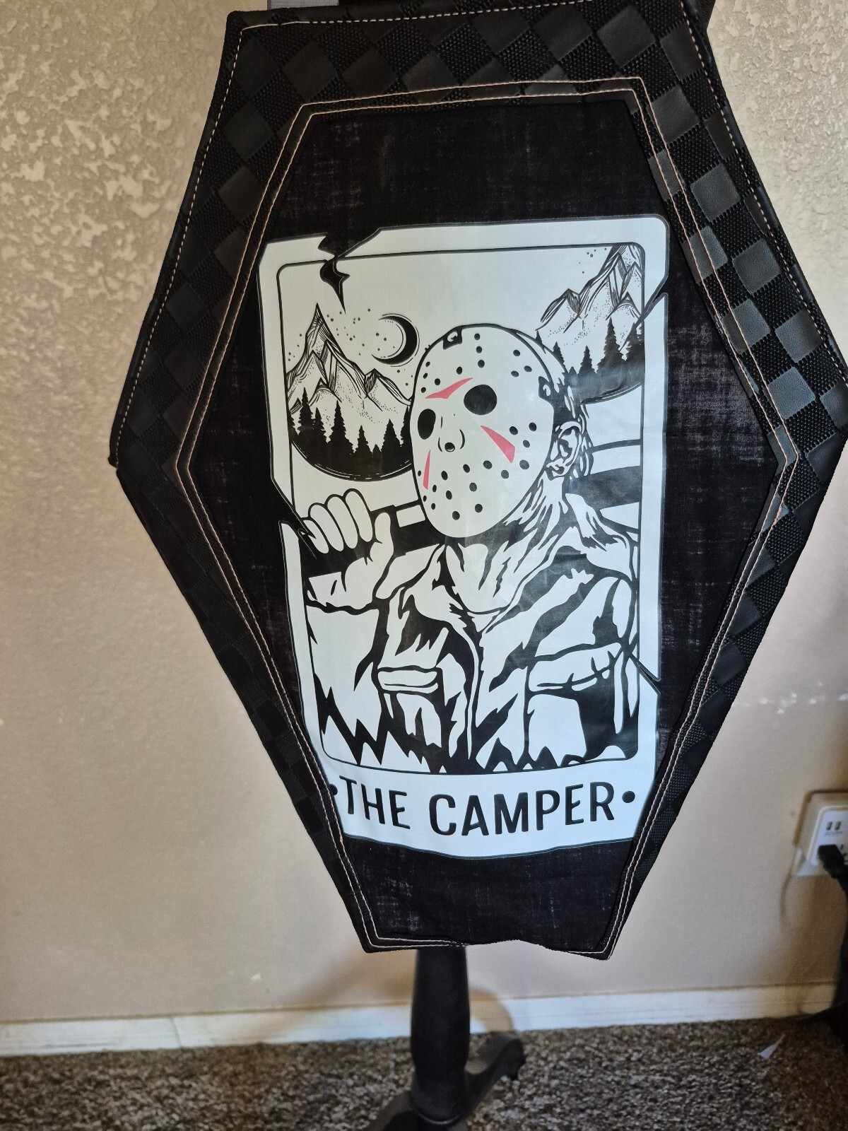 Edgy coffin-shaped tote bag with Camper graphic and waterproof canvas lining.
