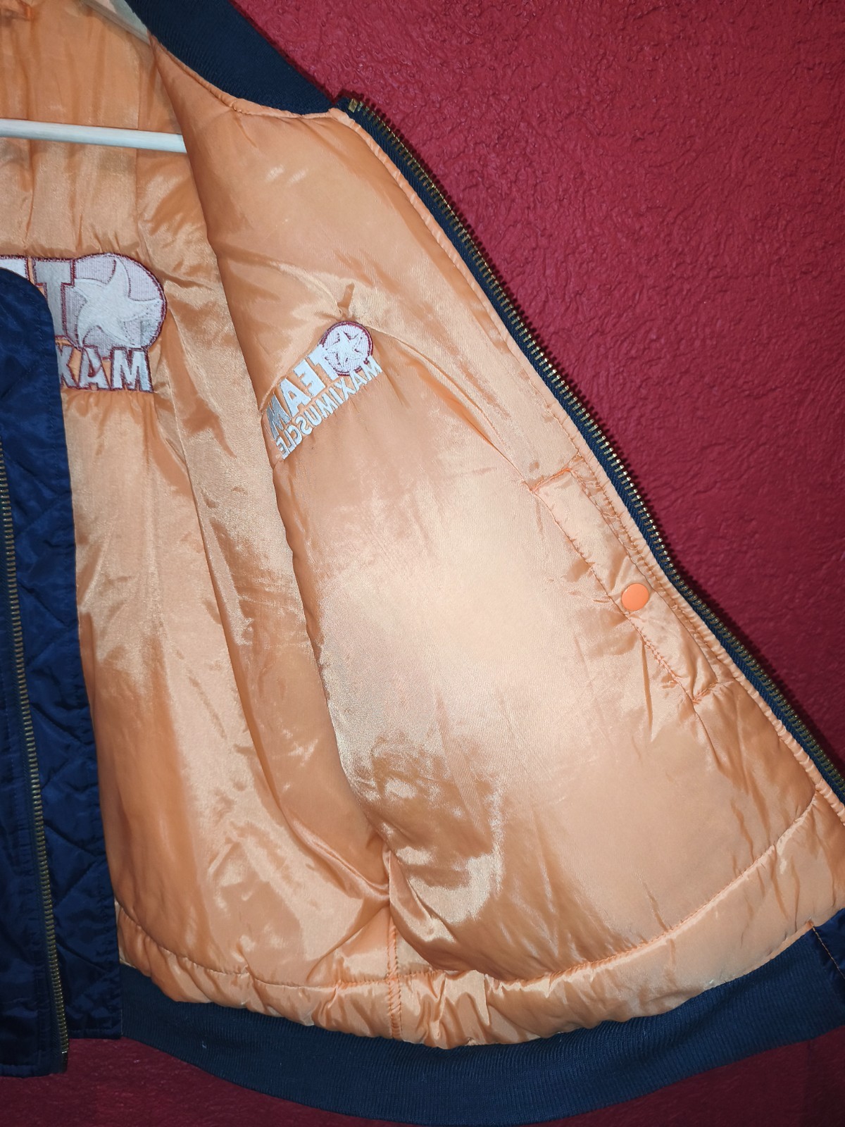 Classic 90s/Y2K bomber jacket featuring bold “Team Maximuscle” chest & back embr