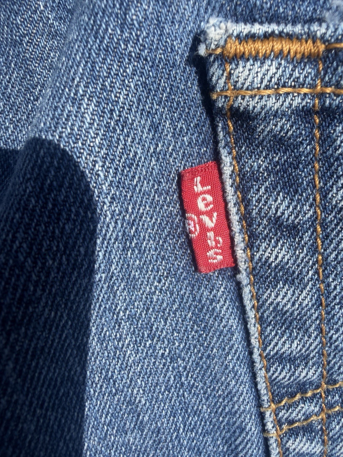 Vintage Levi’s 501 boot cut jeans button fly, dark blue wash size 34