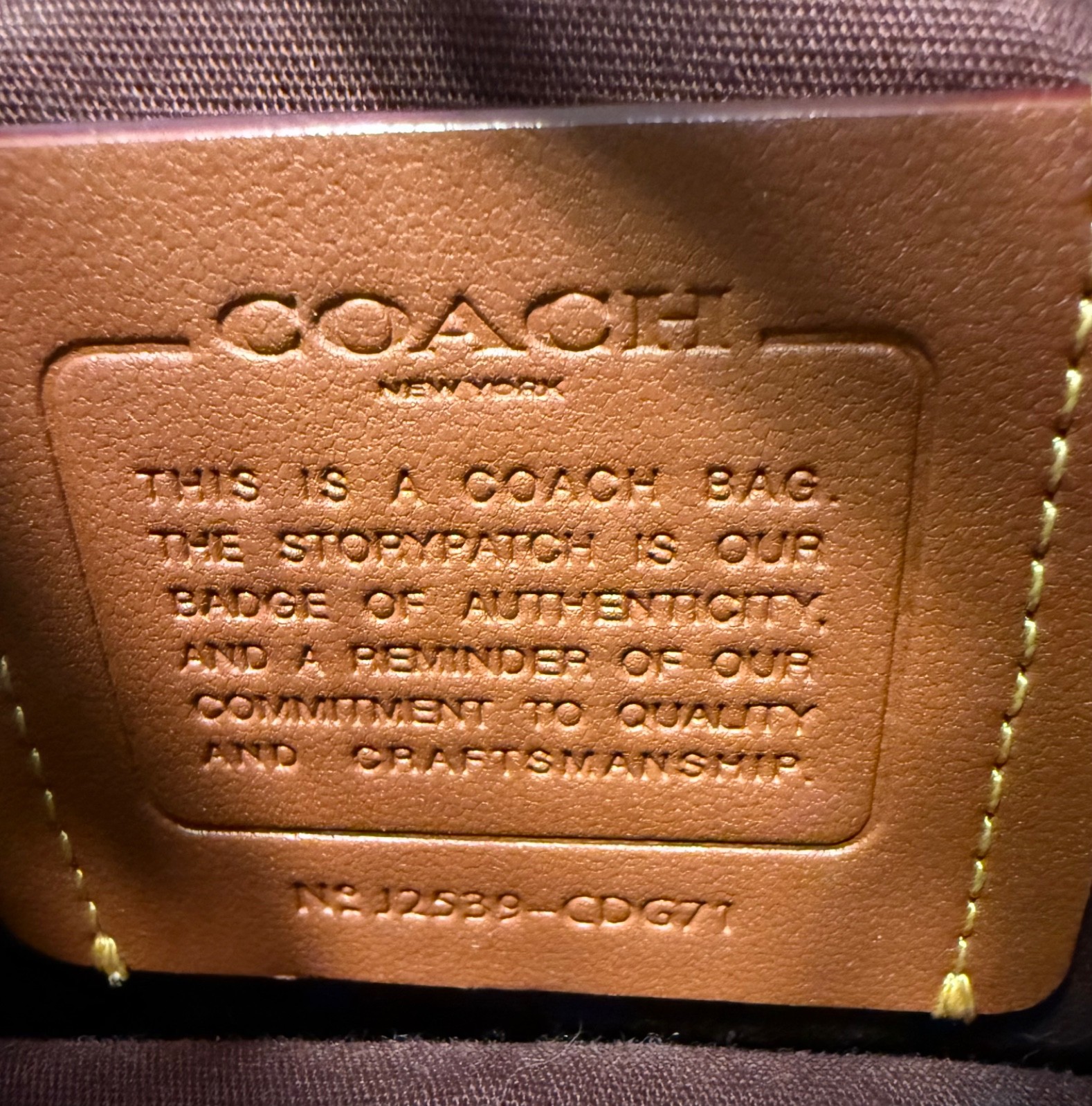 Brown and tan coach bag gently used. With brown stitching and gold hardware.