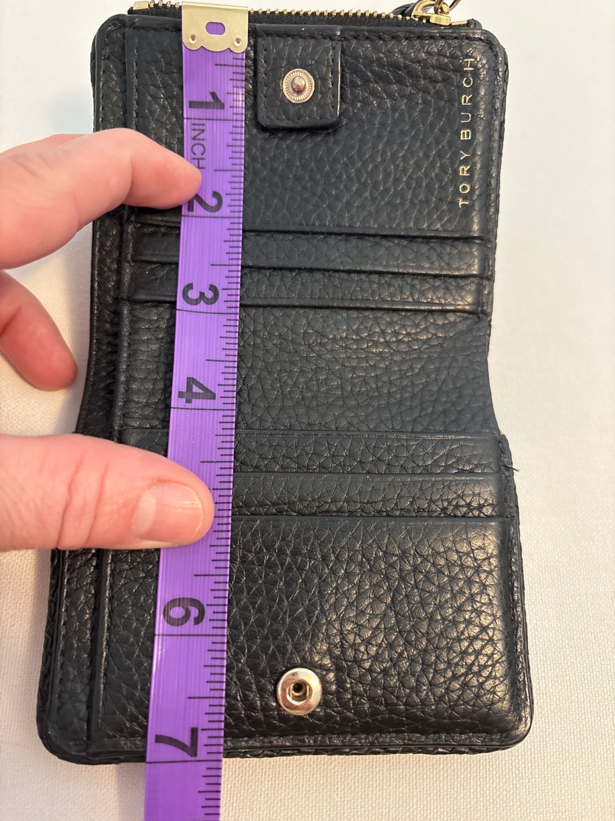 Tory Burch Thea Black Pebbled Leather Bifold Zip Wallet Tassel Gold Tone Logo