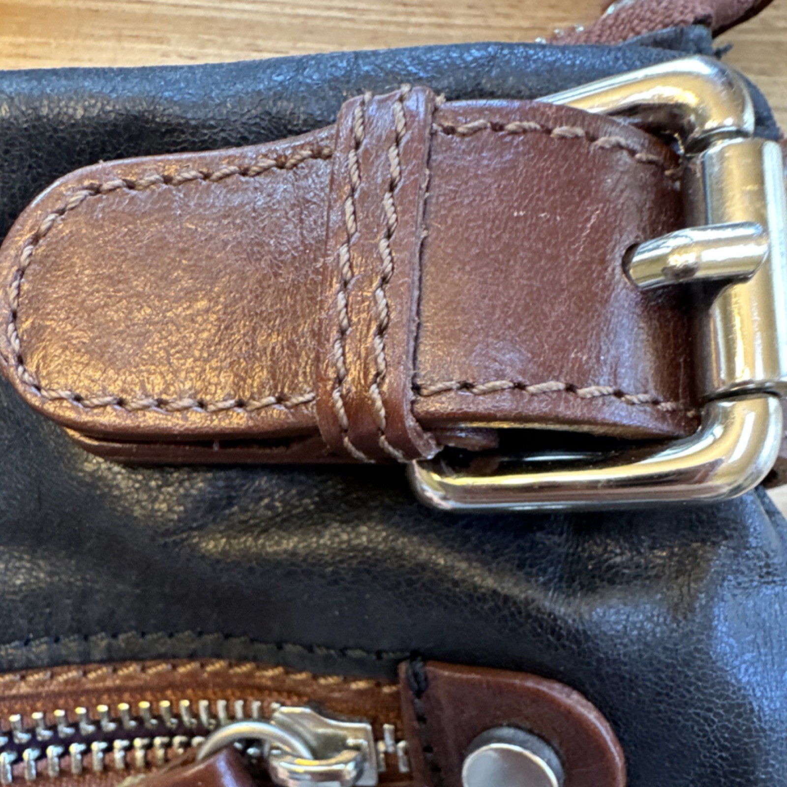 Tano Black Shoulder Bag Brown Strap Buckle Accent Zipper Silver Hardware