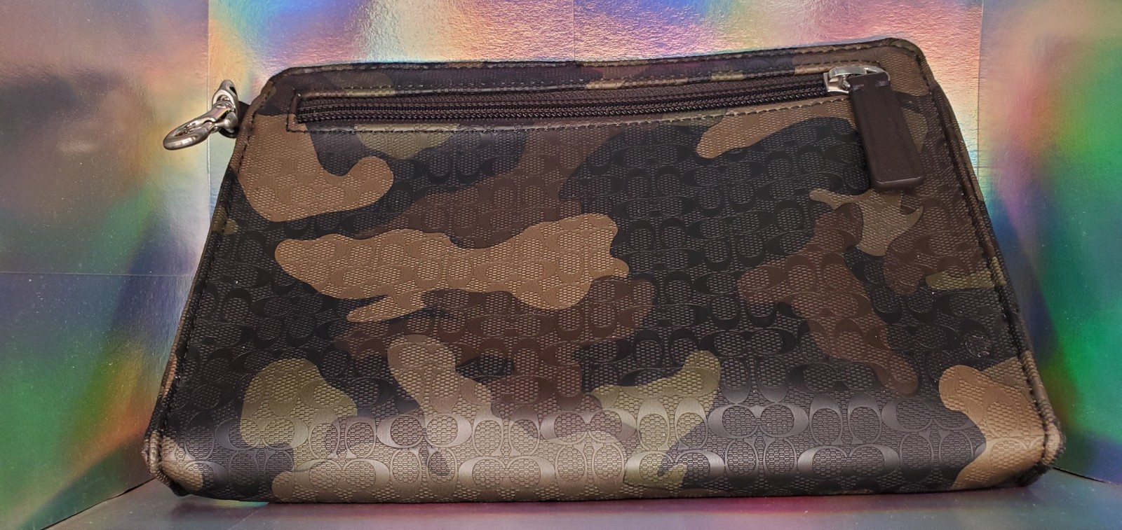 Coach pouch bag, green camouflage with front zipper, no wrist strap, looks great