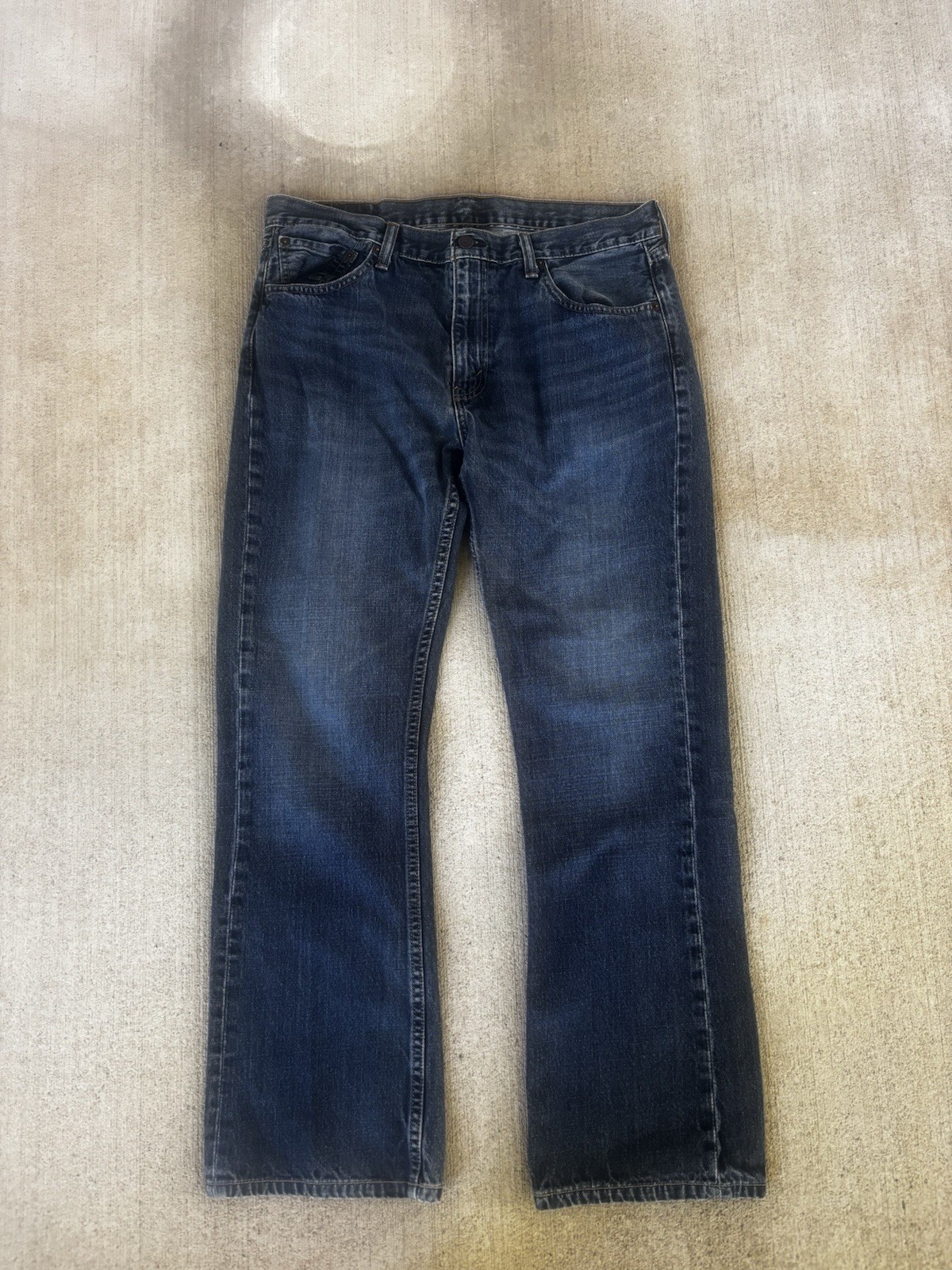 Modern Levis 527 bootcut jeans in a dark blue denim