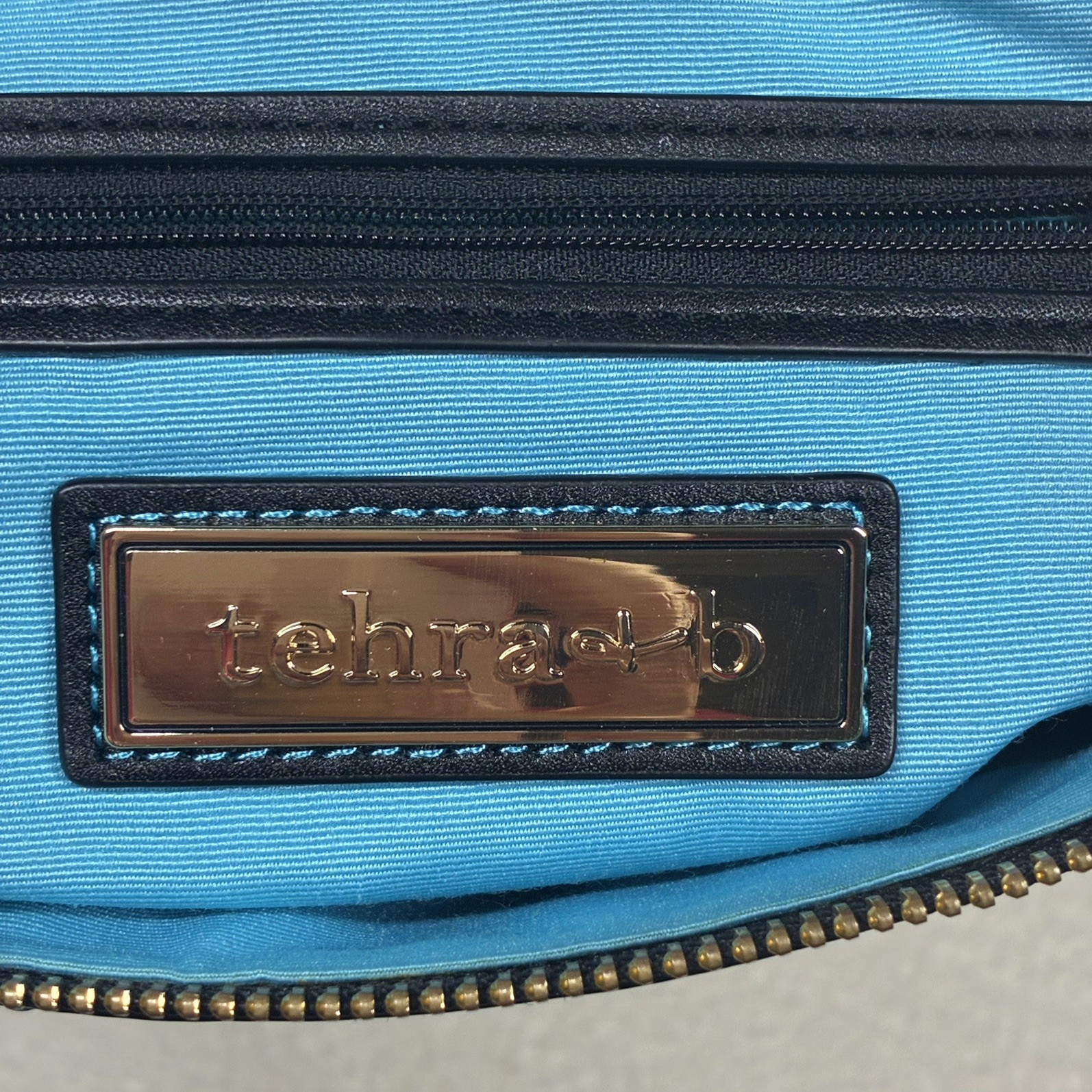 Tehra & B Black Leather Wristlet Clutch Hand-tied Signature Knots Blue Trim