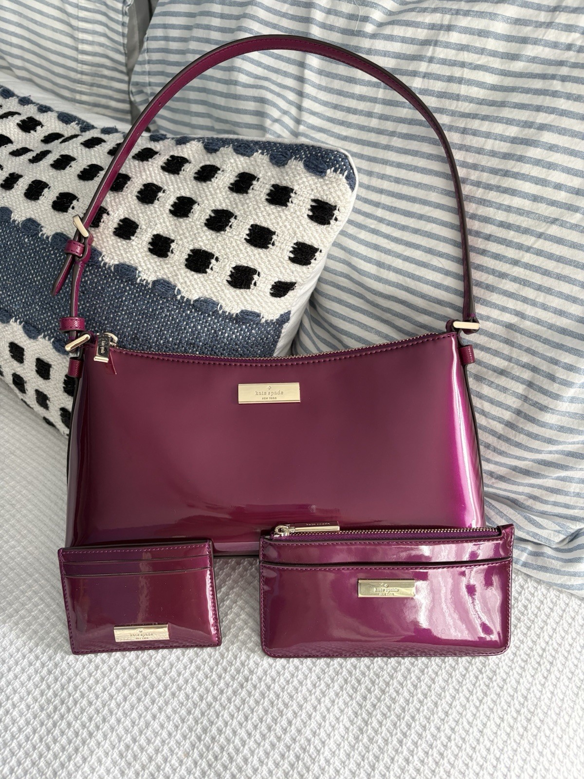 Kate Spade New York Kenzie in Dark Raspberry with matching wallets
