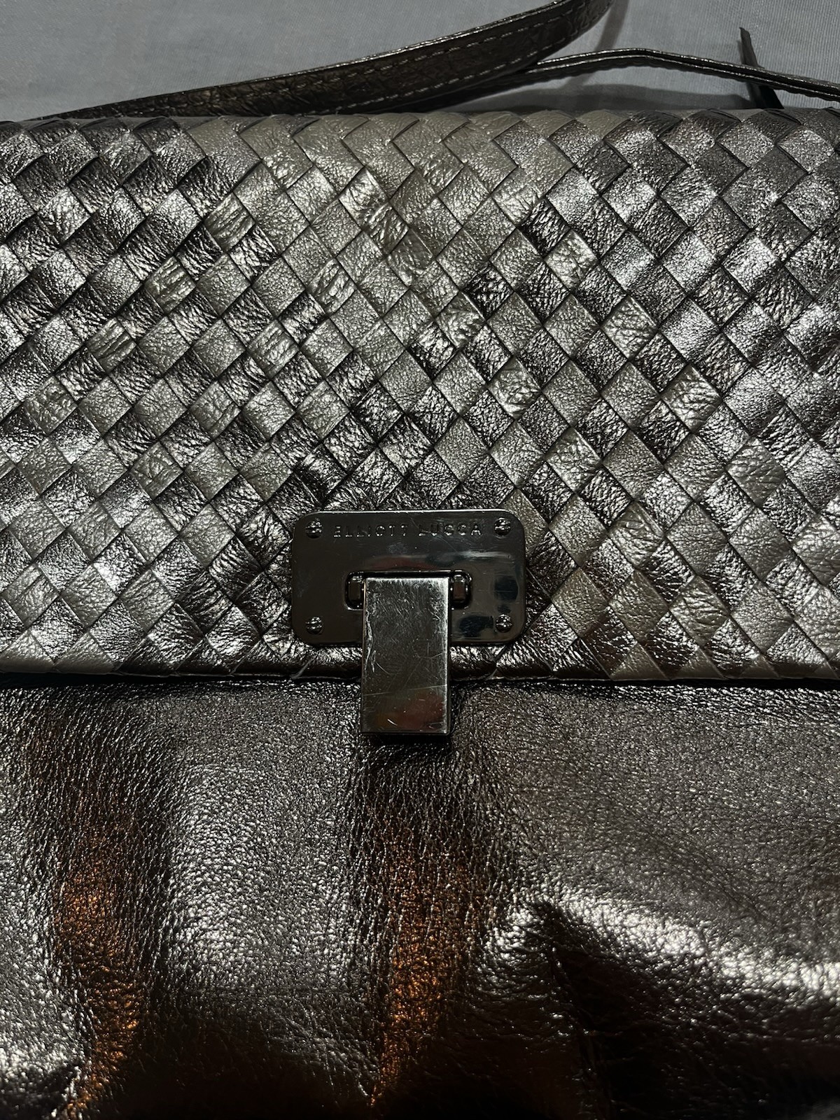 Elliott Lucca metallic woven leather convertible clutch/crossbody bag.