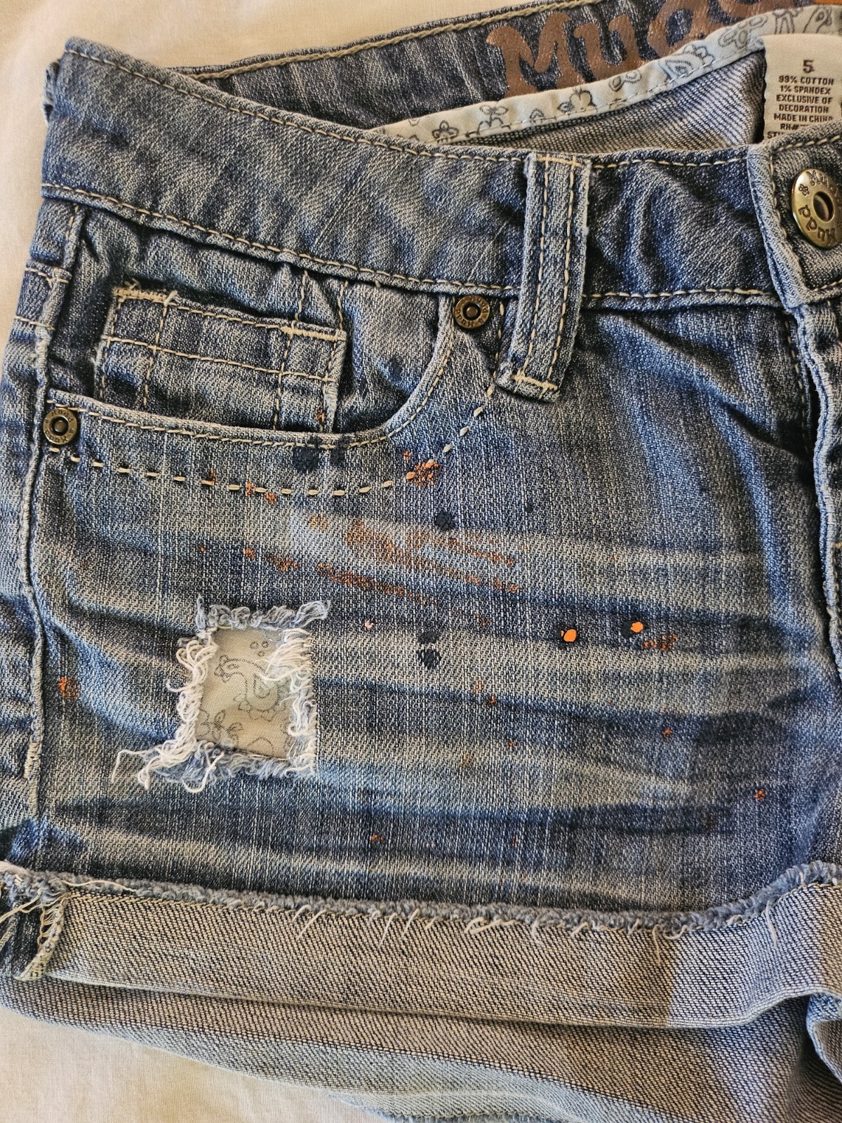 MUDD Low Rise Blue Denim Women’s Shorts with Orange Pink Paint-Splatter Size 5
