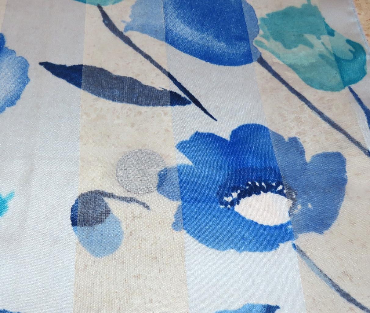 Oblong floral scarf; blue tones, white; 60×14.5 in. Semisheer; poly blend?