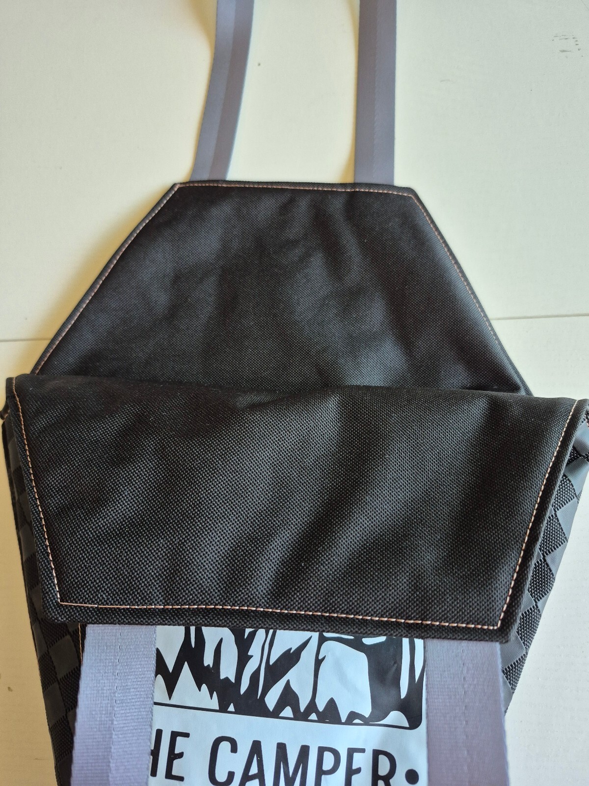 Edgy coffin-shaped tote bag with Camper graphic and waterproof canvas lining.