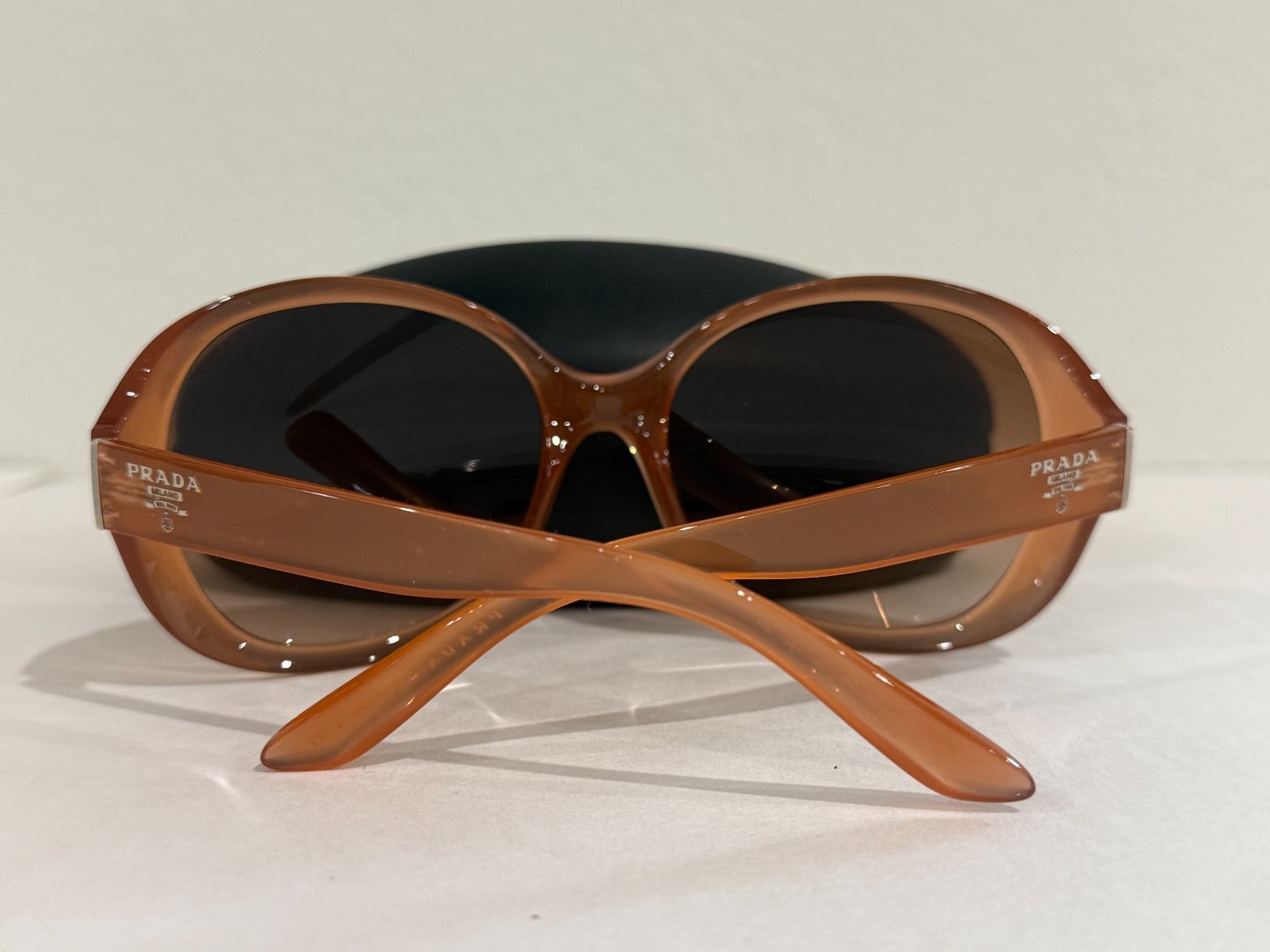 Prada Sunglasses SPR 04O semi-traslucent frame oversized rounded rims
