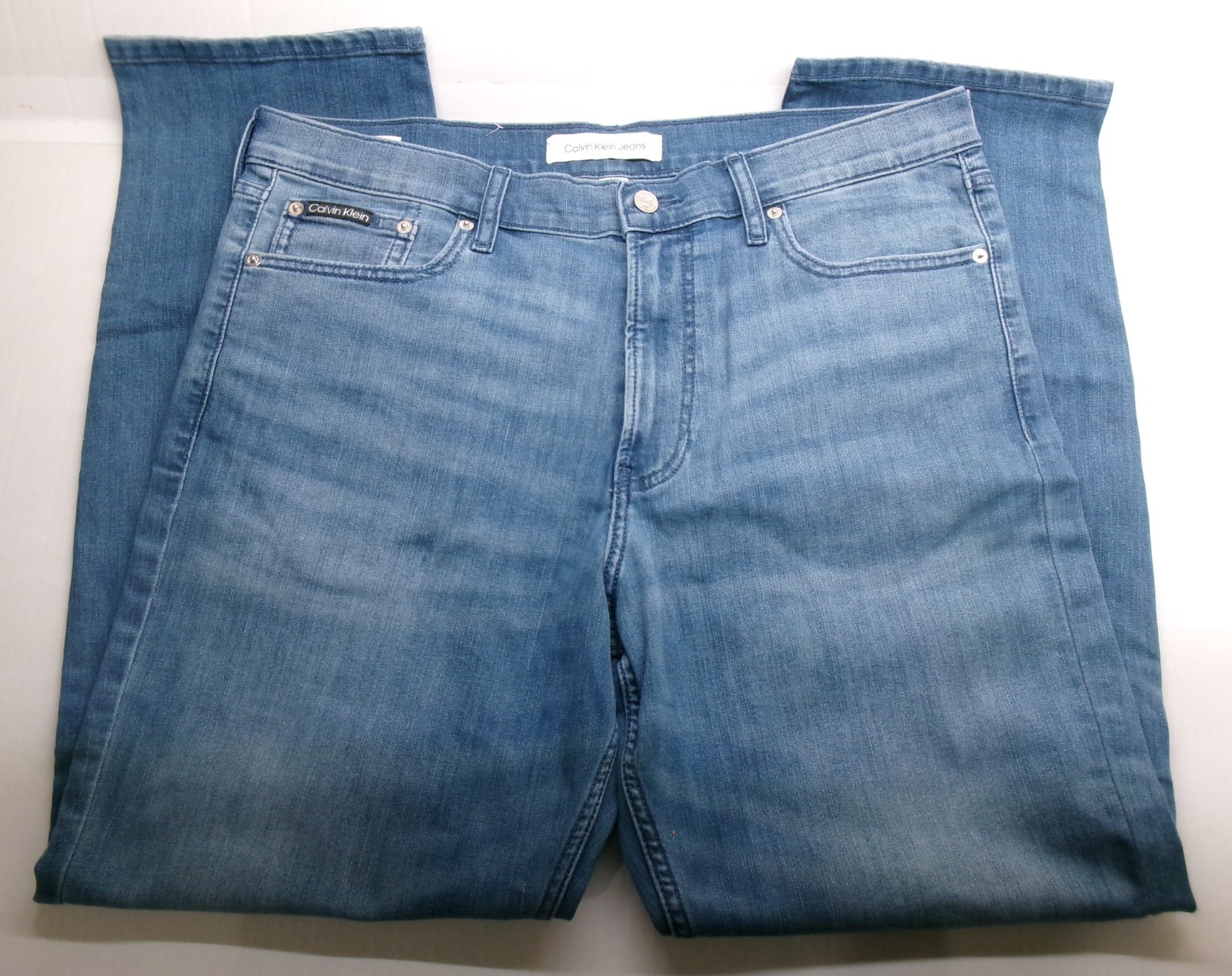 Calvin Klein Straight Leg Jeans sits below waist easy fit hip &thigh Medium Wash