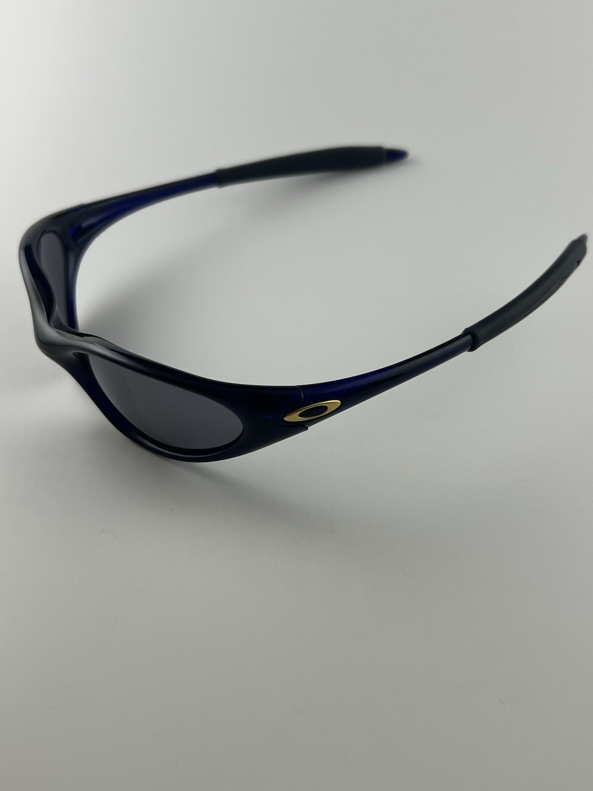 Oakley Minute 1.0 Crystal Blue Frame Black Iridium Lens Gold Icons XX RARE